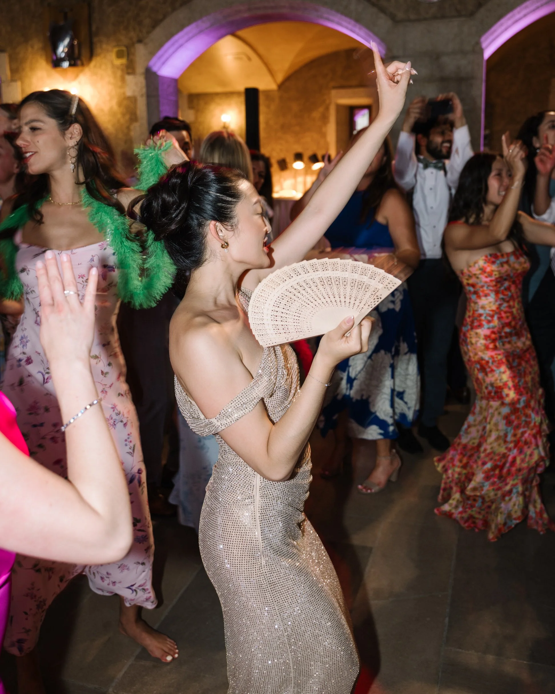 Bride dancing in her party dress