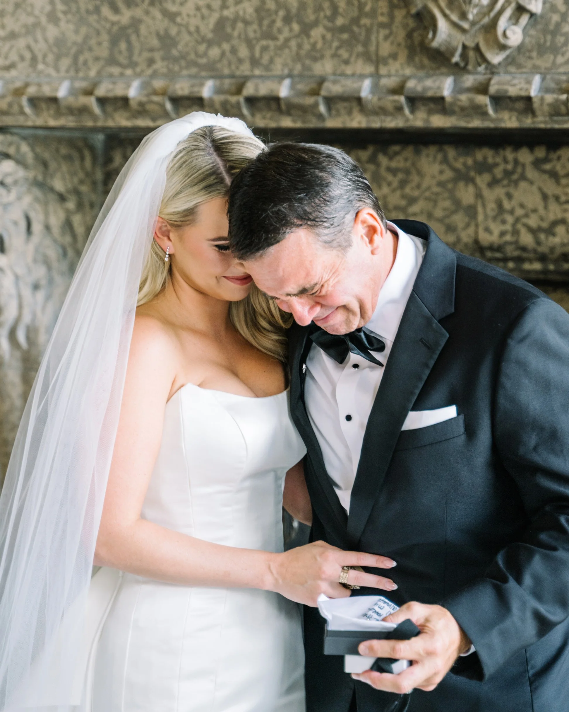 Bride and dad cry with gift exchange 