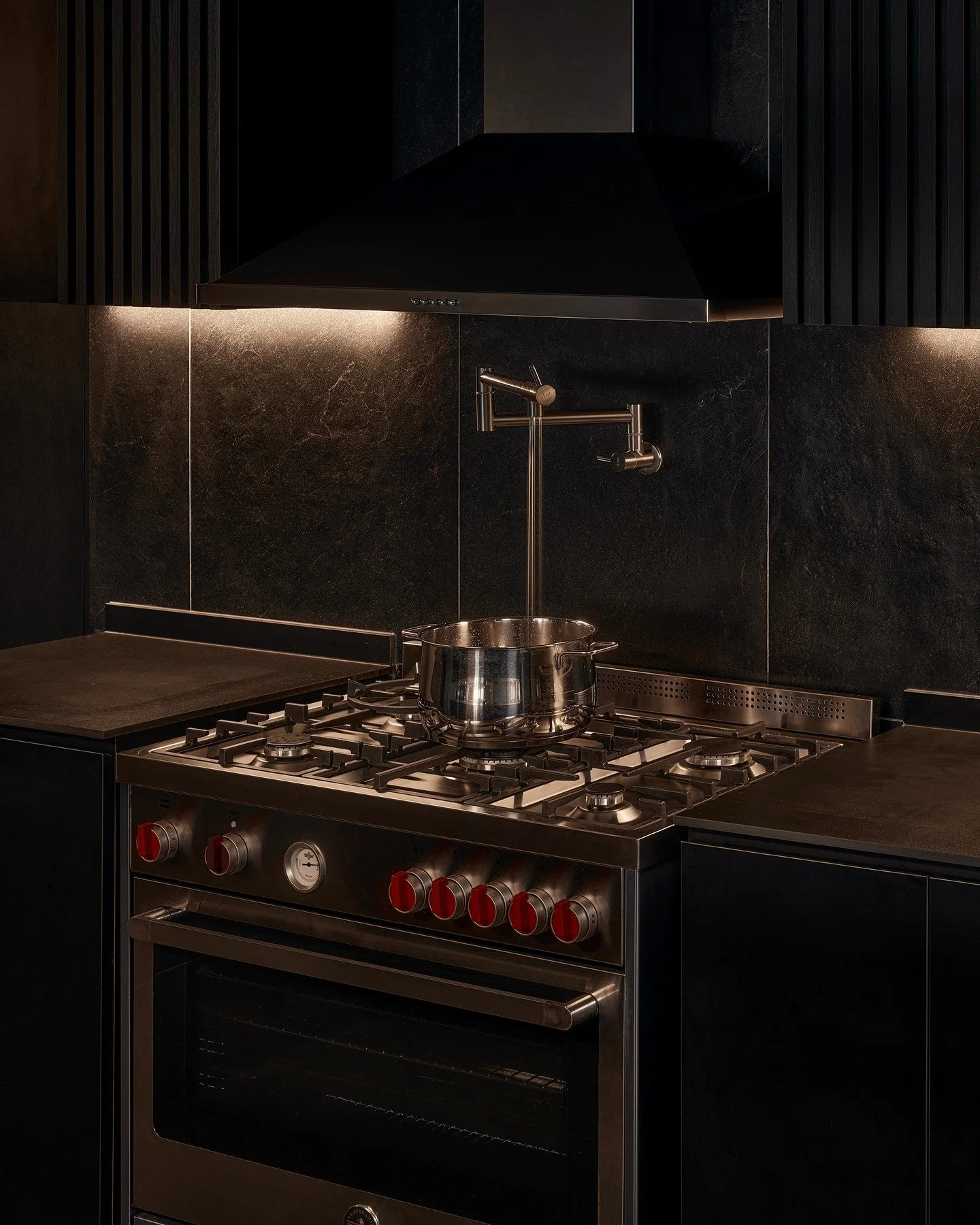 Pop quiz: how do you add variety when designing a home thats uncompromisingly black?

We did so by choosing materials that varied in gloss, texture and details. As such, a total of eight laminate types and seven tile types were used.

Look closely an