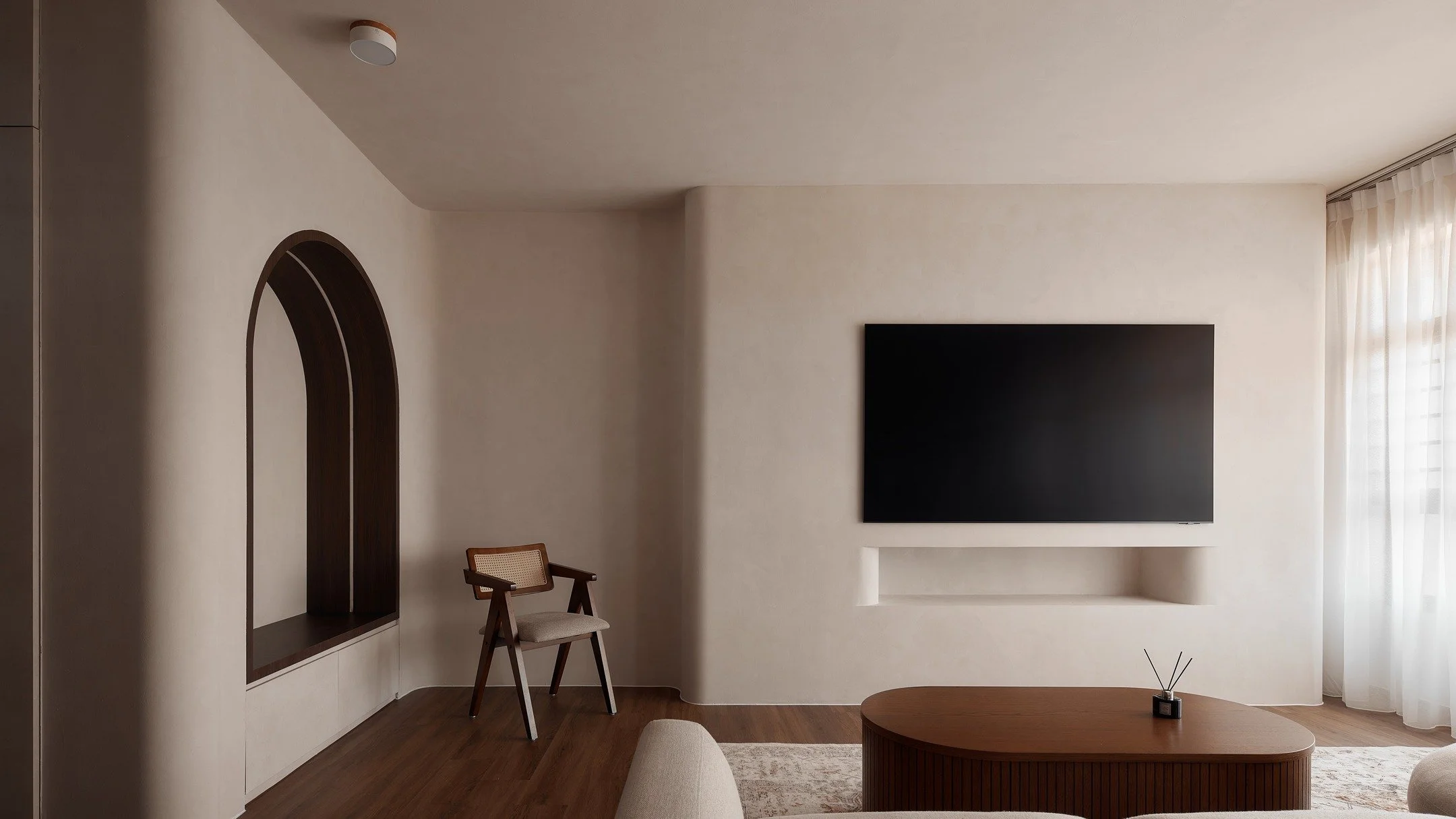 This living room is clean, flowy and soothes the mind ❤️

Here's what we did:

1. lime washed the walls;
2. built a long and curvy partition wall; and
3. laid the floor in a matching tone vinyl.

It pays to be deliberate with colours and materials. S