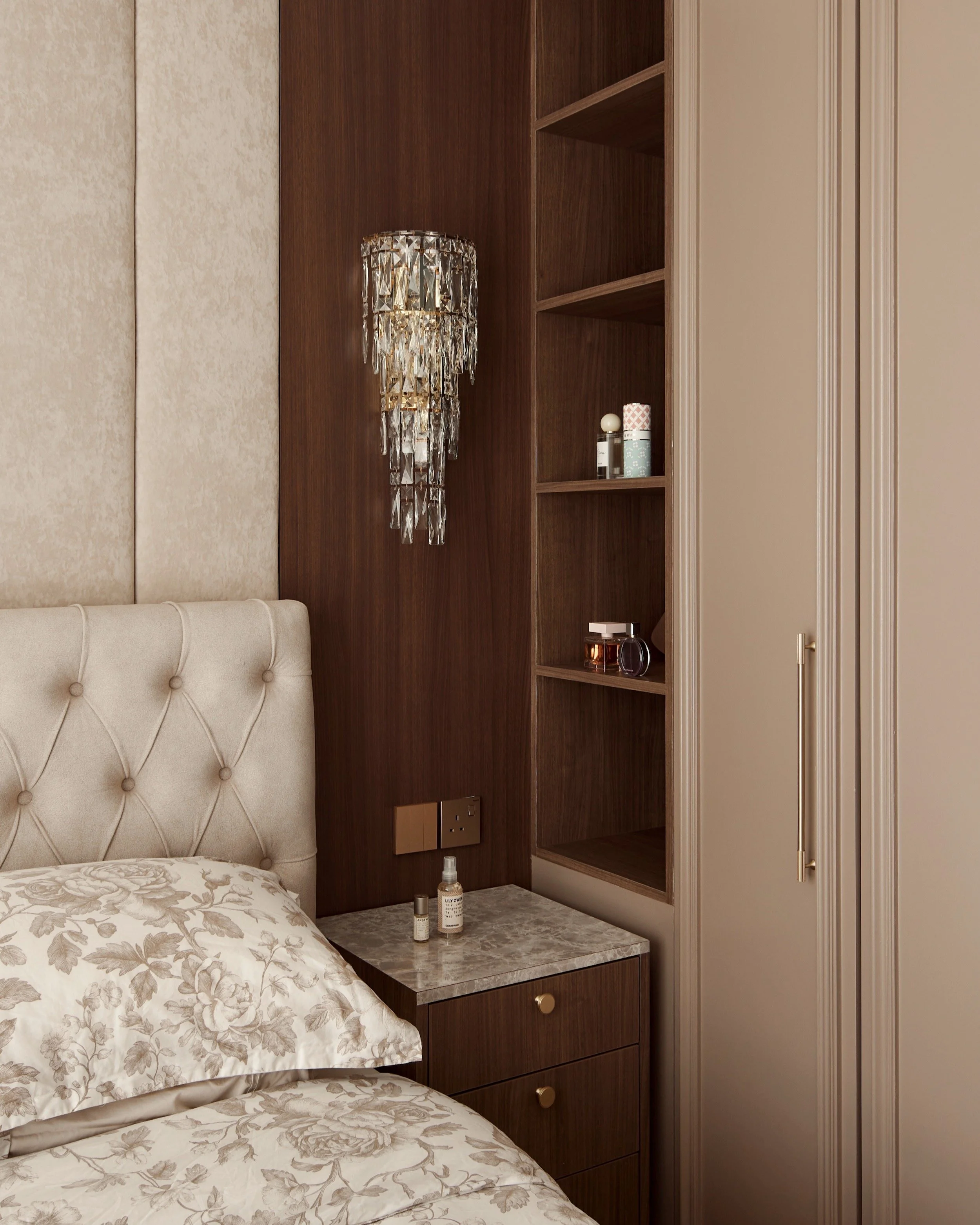 This hidden seat was a nice idea to create a dressing area. Tucked away, the wall becomes symmetrical again. 

Who would have thought that one tiny move could allow us to achieve both the visual and practical requirements.

We were glad to hear from 