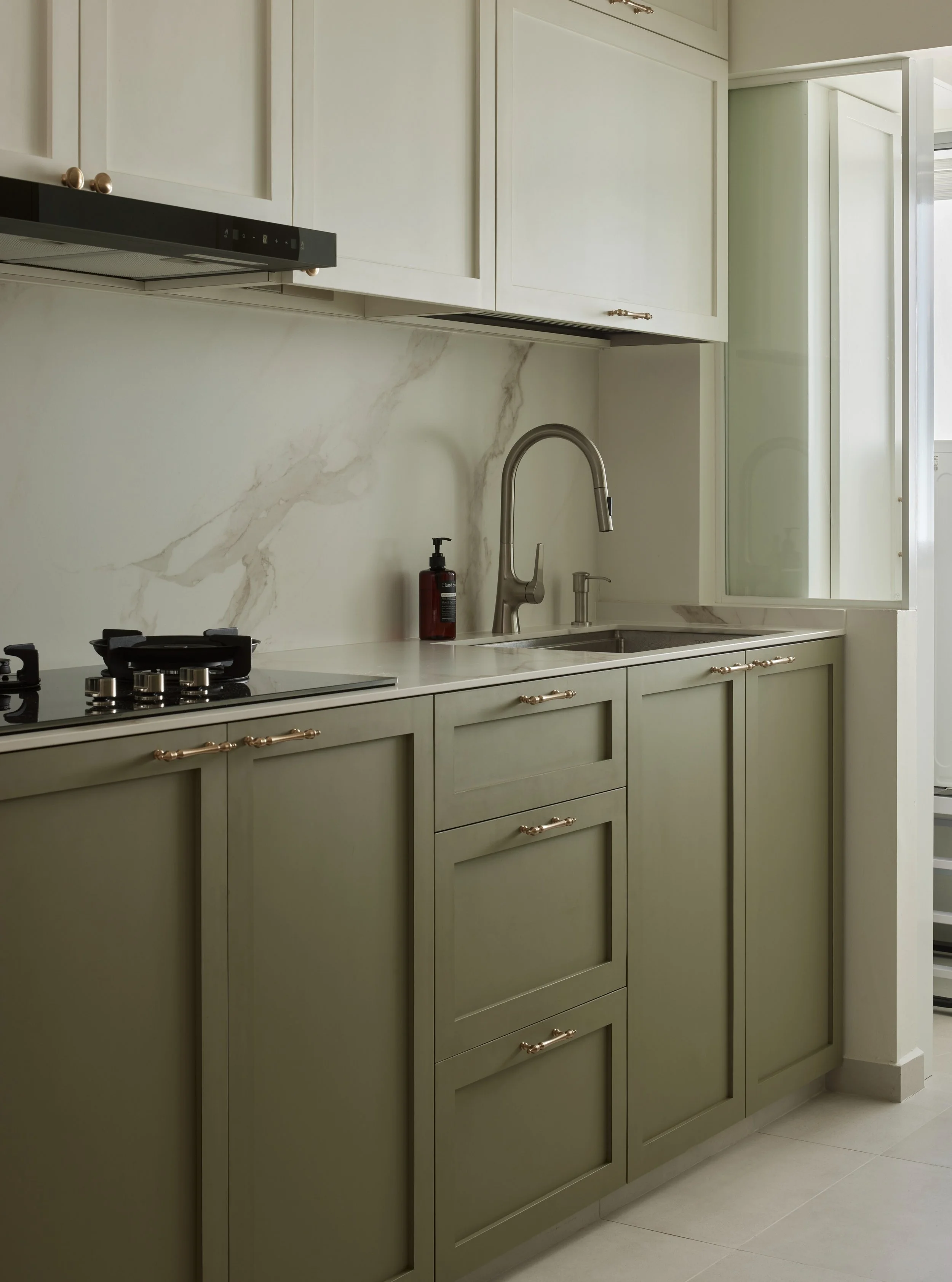 Here's more views of the kitchen.

When in it, the space appears to be bathed in a greenish light, possibly from the film used on the windows or perhaps it is light reflecting off the laminates, or both.

It creates this lovely effect, similar to wha