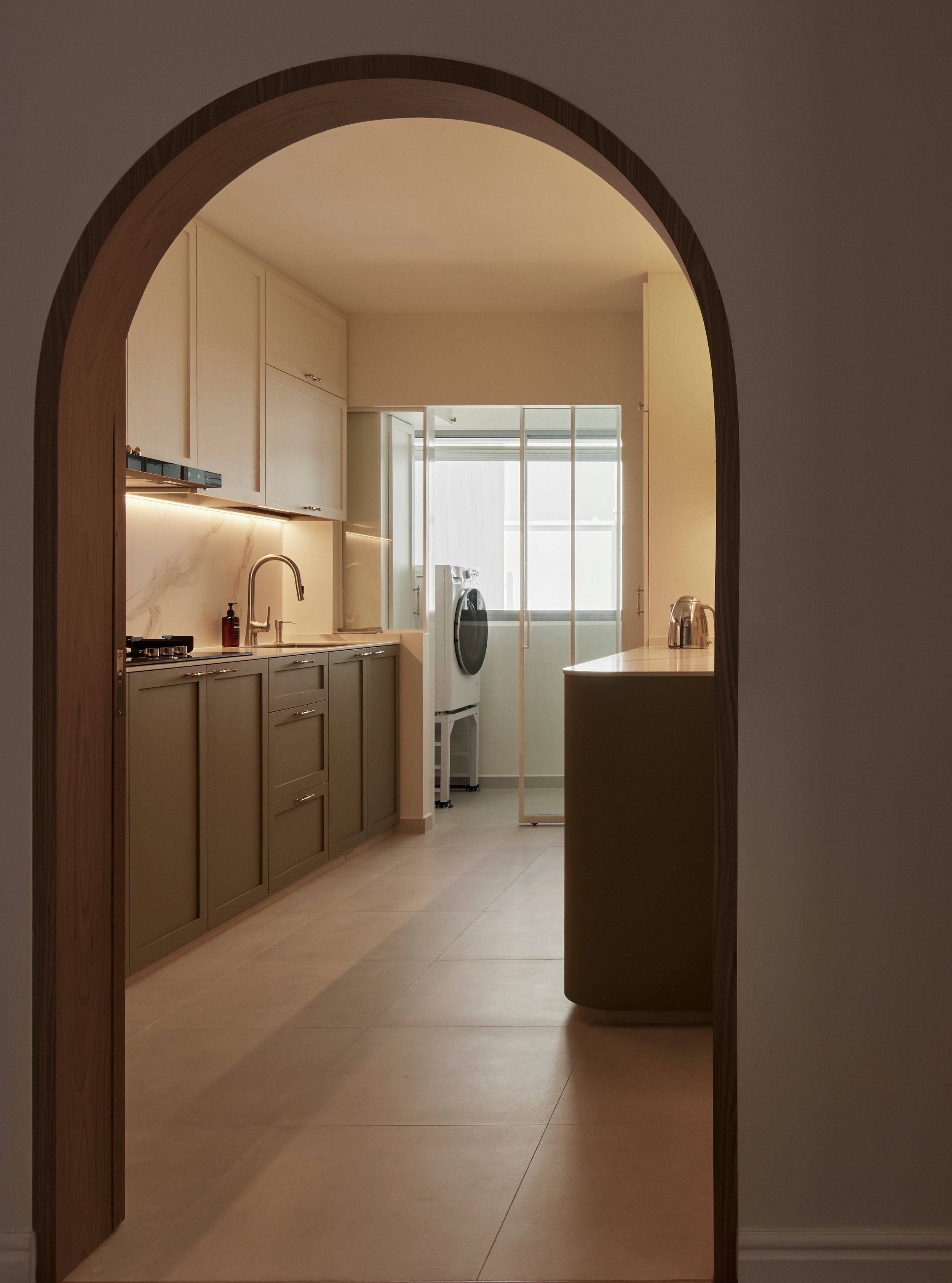 This farmhouse style door has to be our favourite bespoke item in this house. 

It is rustic and charming. The wood laminate matches well with the green, grey and white in the kitchen. Overall, this door frames the kitchen perfectly. 

We like bespok
