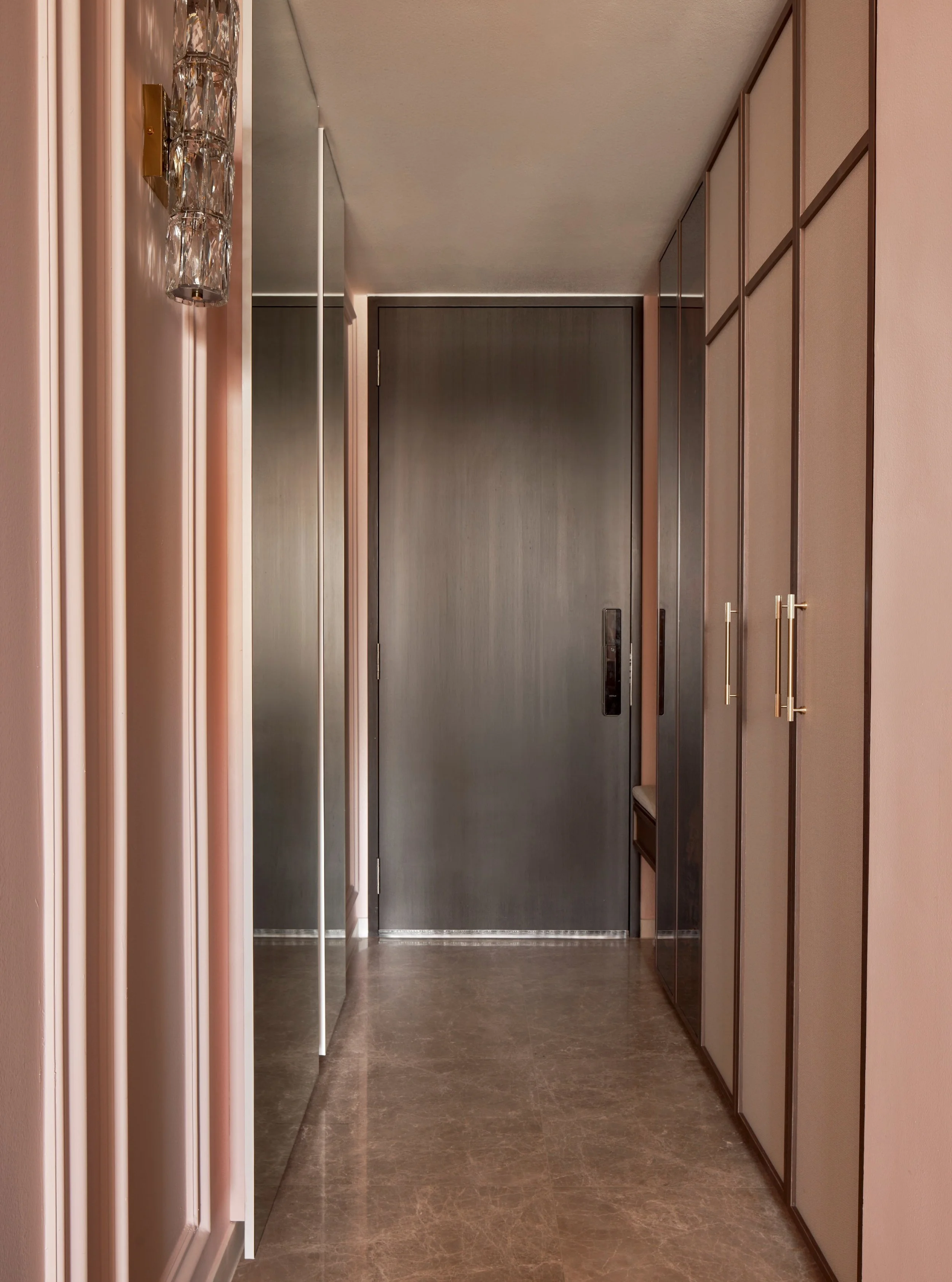 This was once a rather dull and featureless foyer (swipe right to see renders and before photos).

It has since been transformed with various design elements.

The original area covering the DB is absorbed by the new cabinets. There's also a settee n