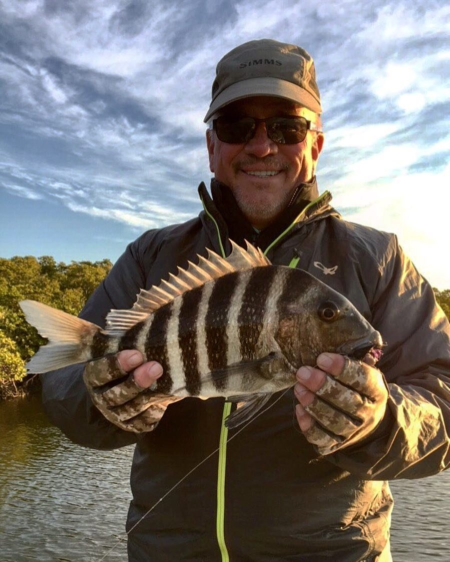 Matt with his first sheepshead on fly on a chilly day