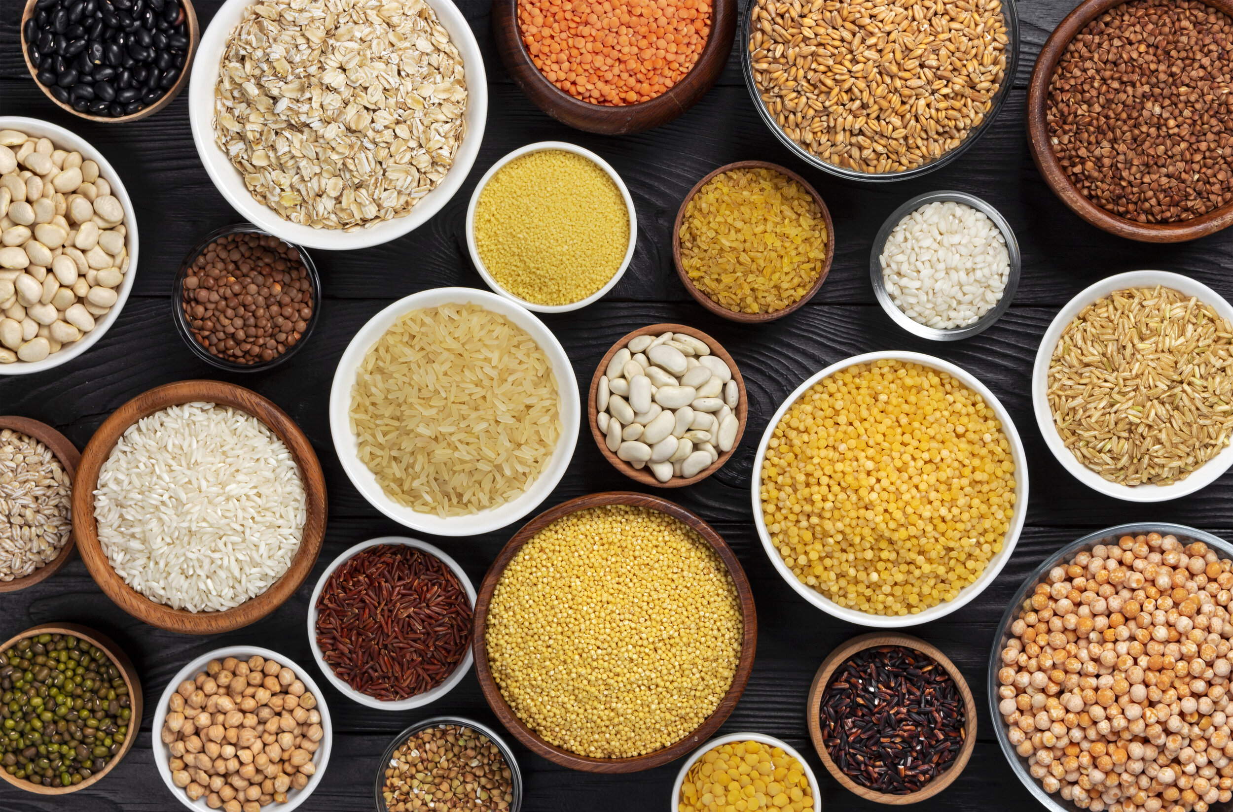 cereals-grains-seeds-groats-black-wooden-background.jpg
