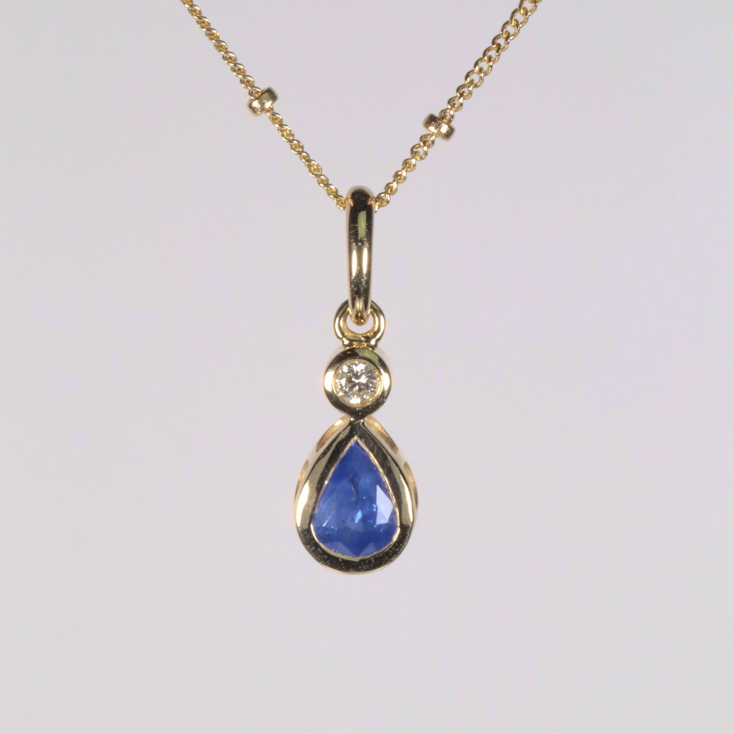 The Mini Petal Charm: 0.77ct Sapphire Pear