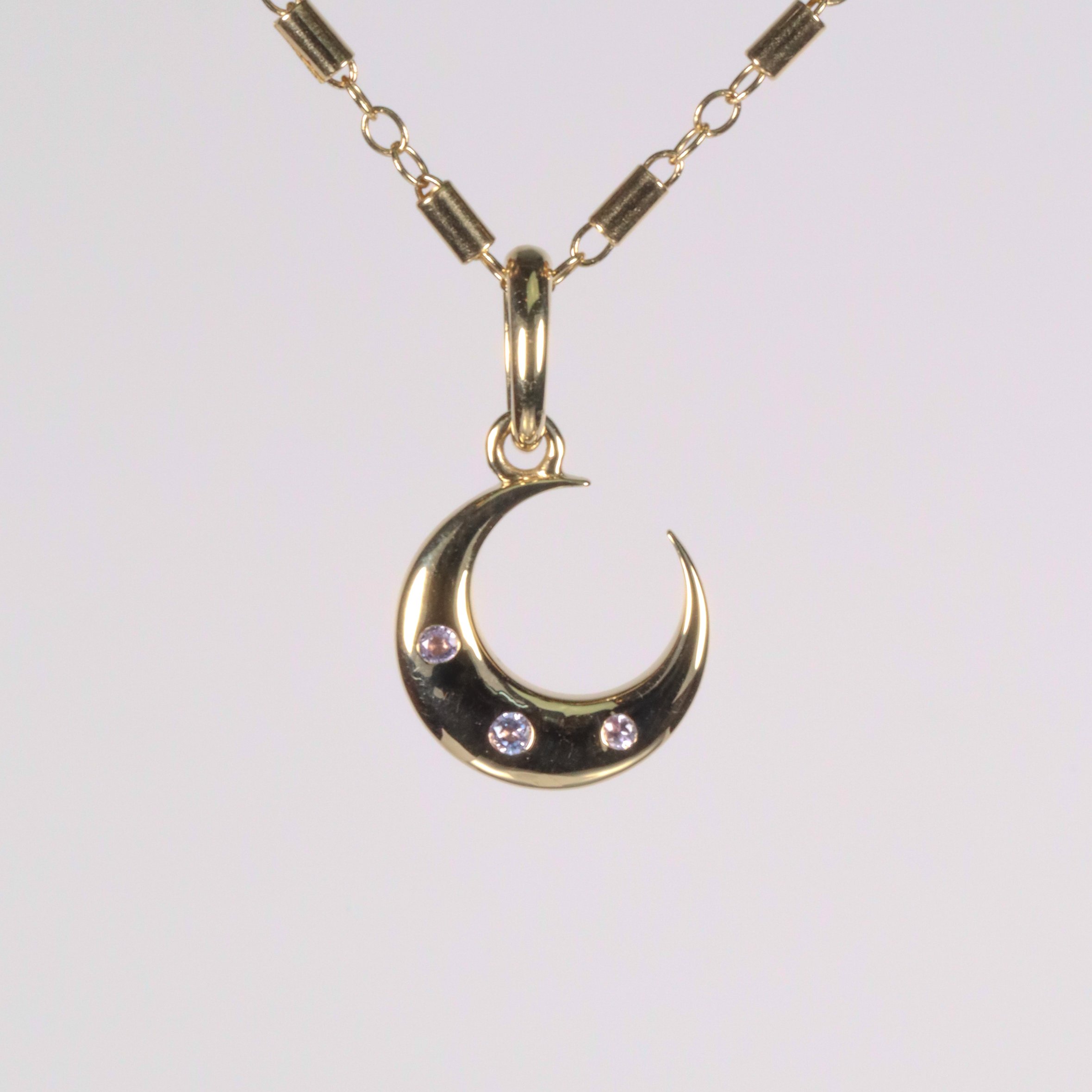 The Crescent Charm: Tanzanite