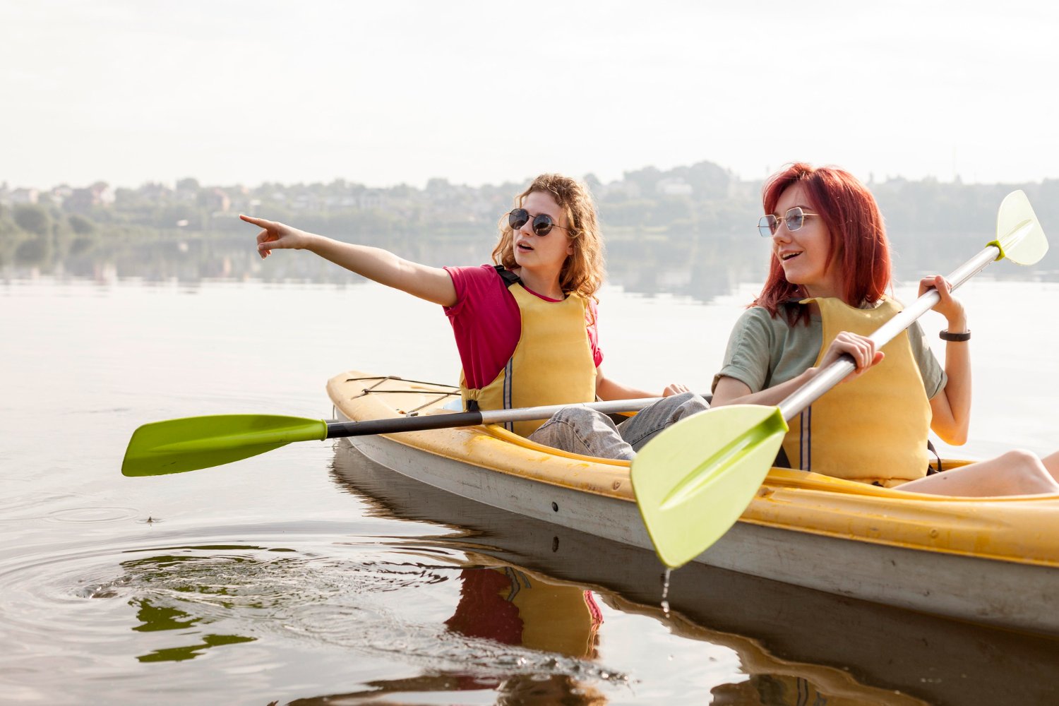 females-rowing-kayak-lake.jpg