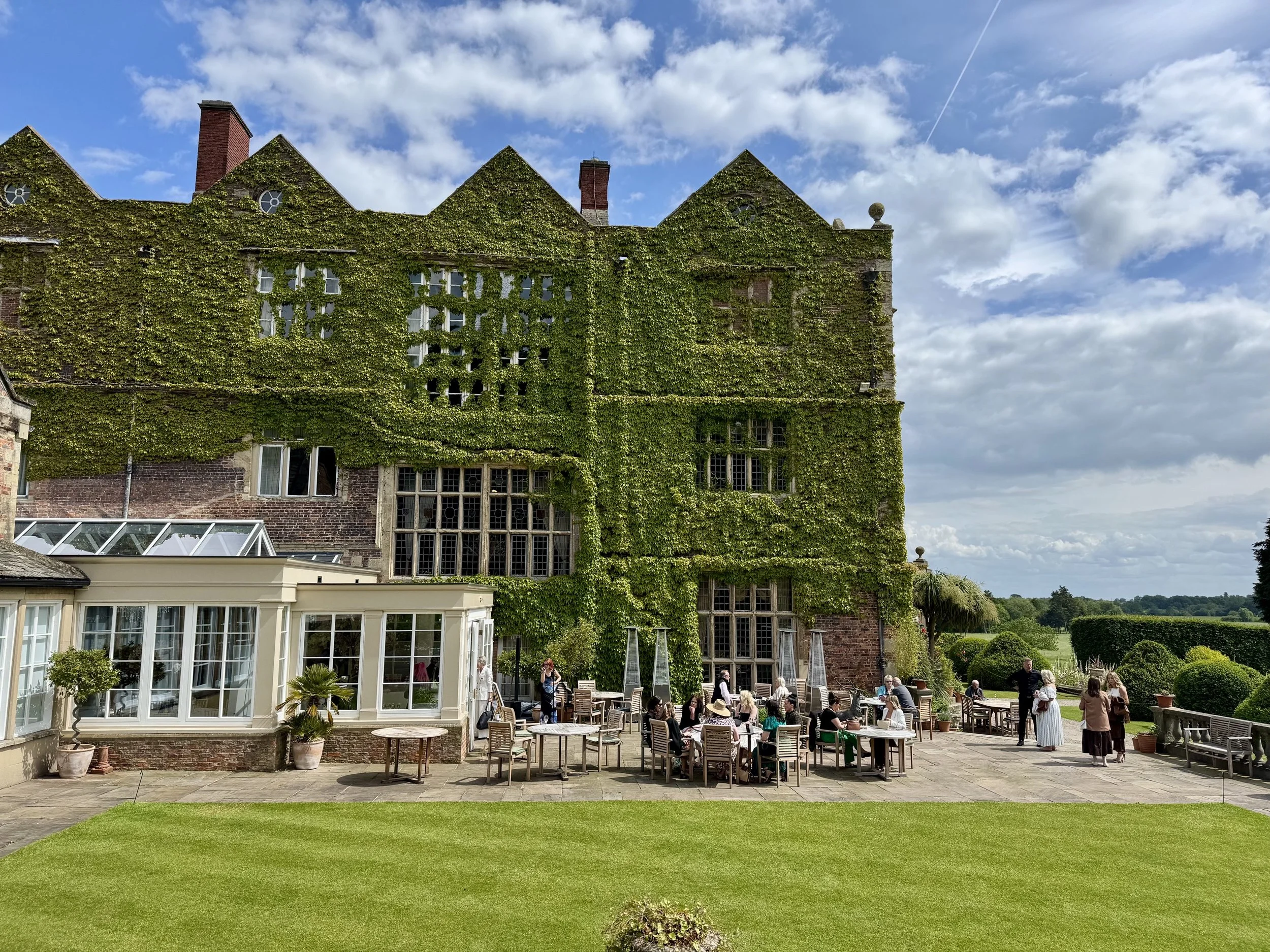 Image shows the afternoon tea terrace at Goldsborough Hall filled with people there to see the gardens