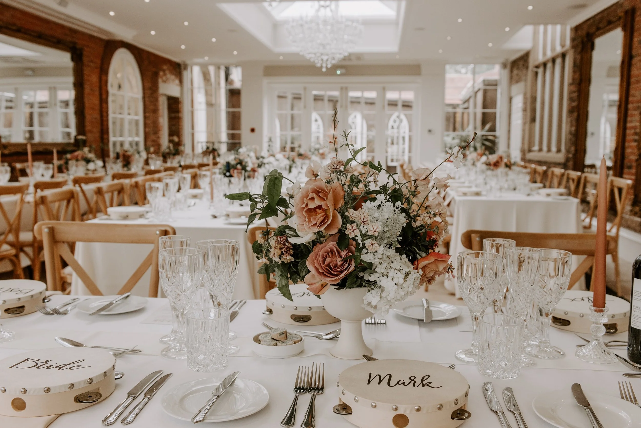 Close up of some flowers on a table for a wedding breakfast in the Orangery