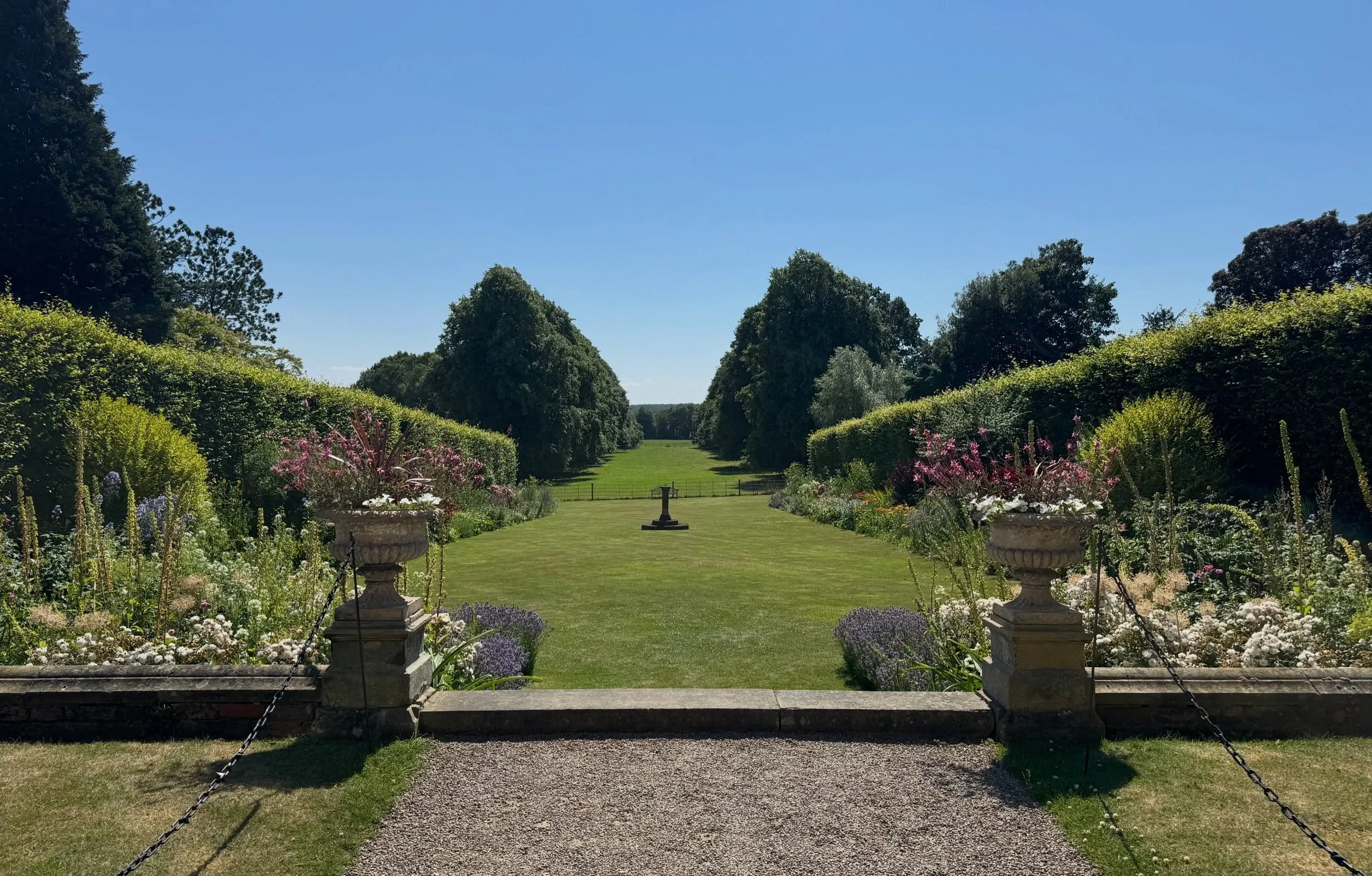 View down the main borders at Goldsborough Hall, a stately home in North Yorkshire