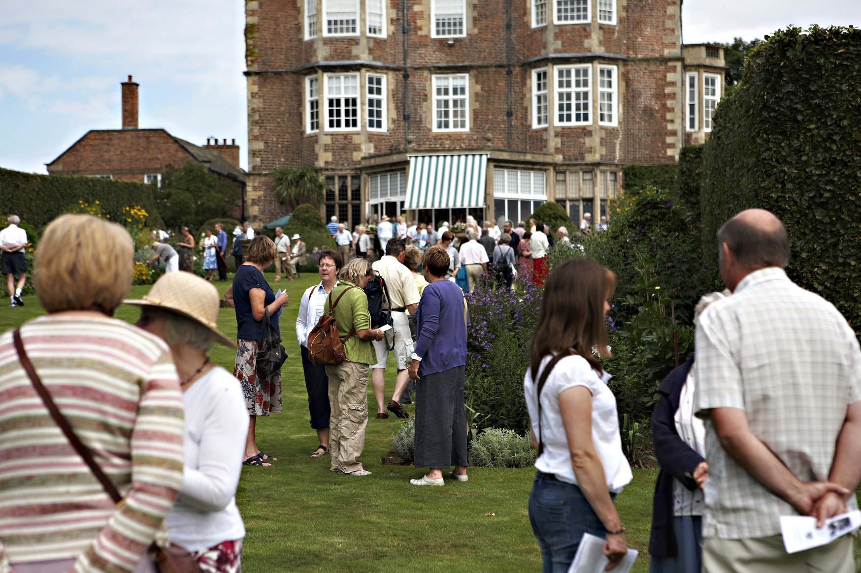 Image shows hundreds of people in the Goldsborough gardens in summer 2010