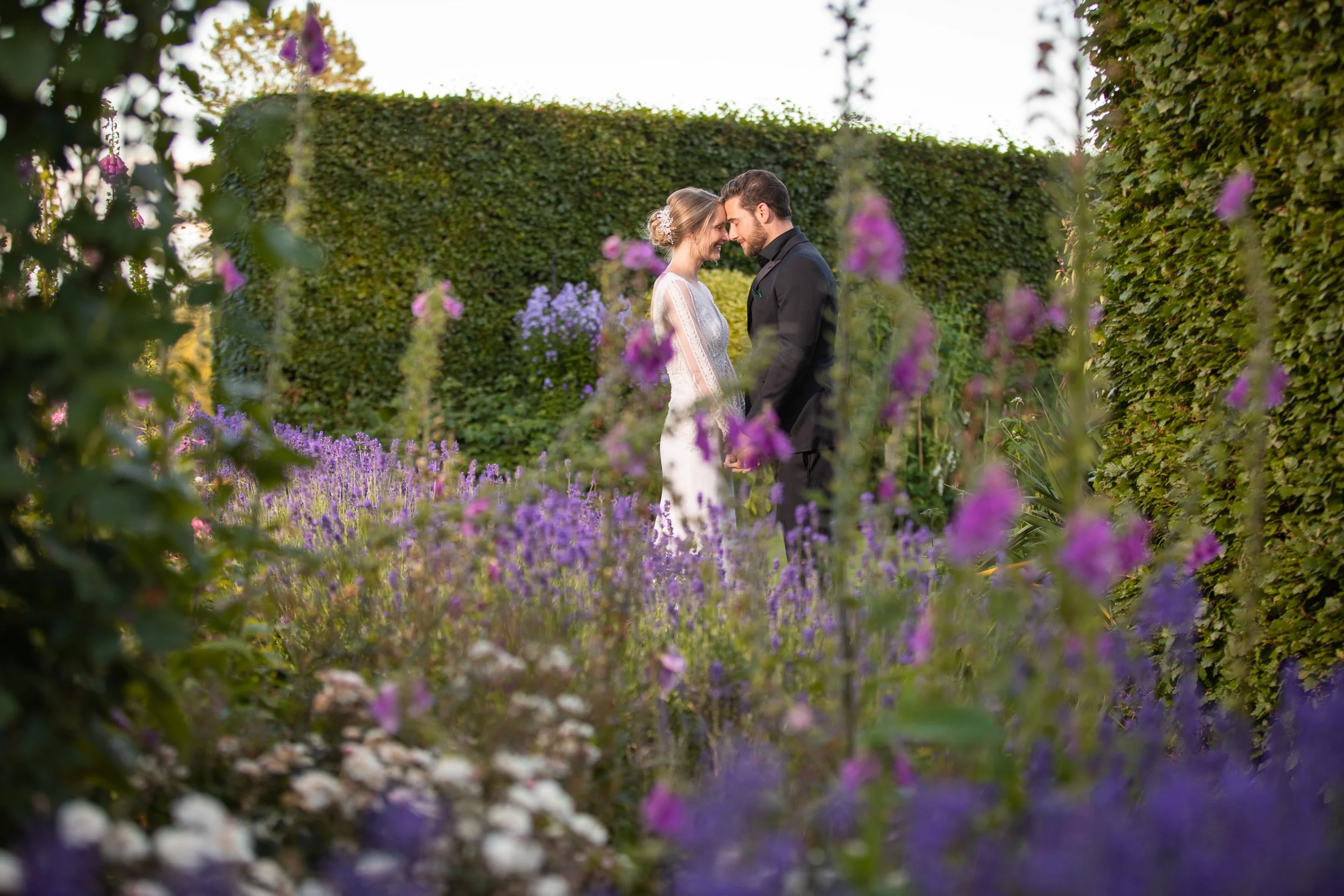 Wedding couple in the gardens at a stately home