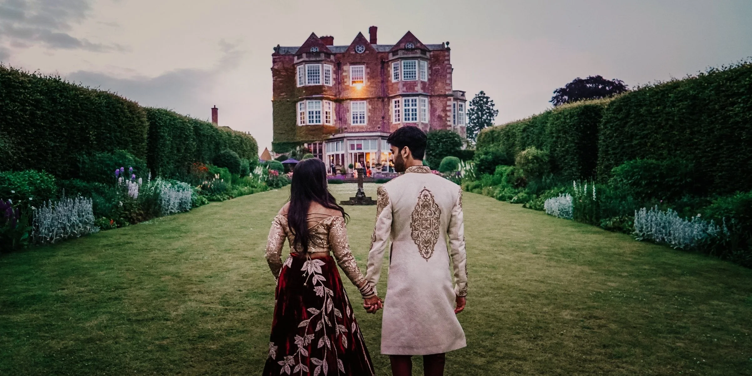 wedding couple in the gardens of goldsborough  hall at dusk