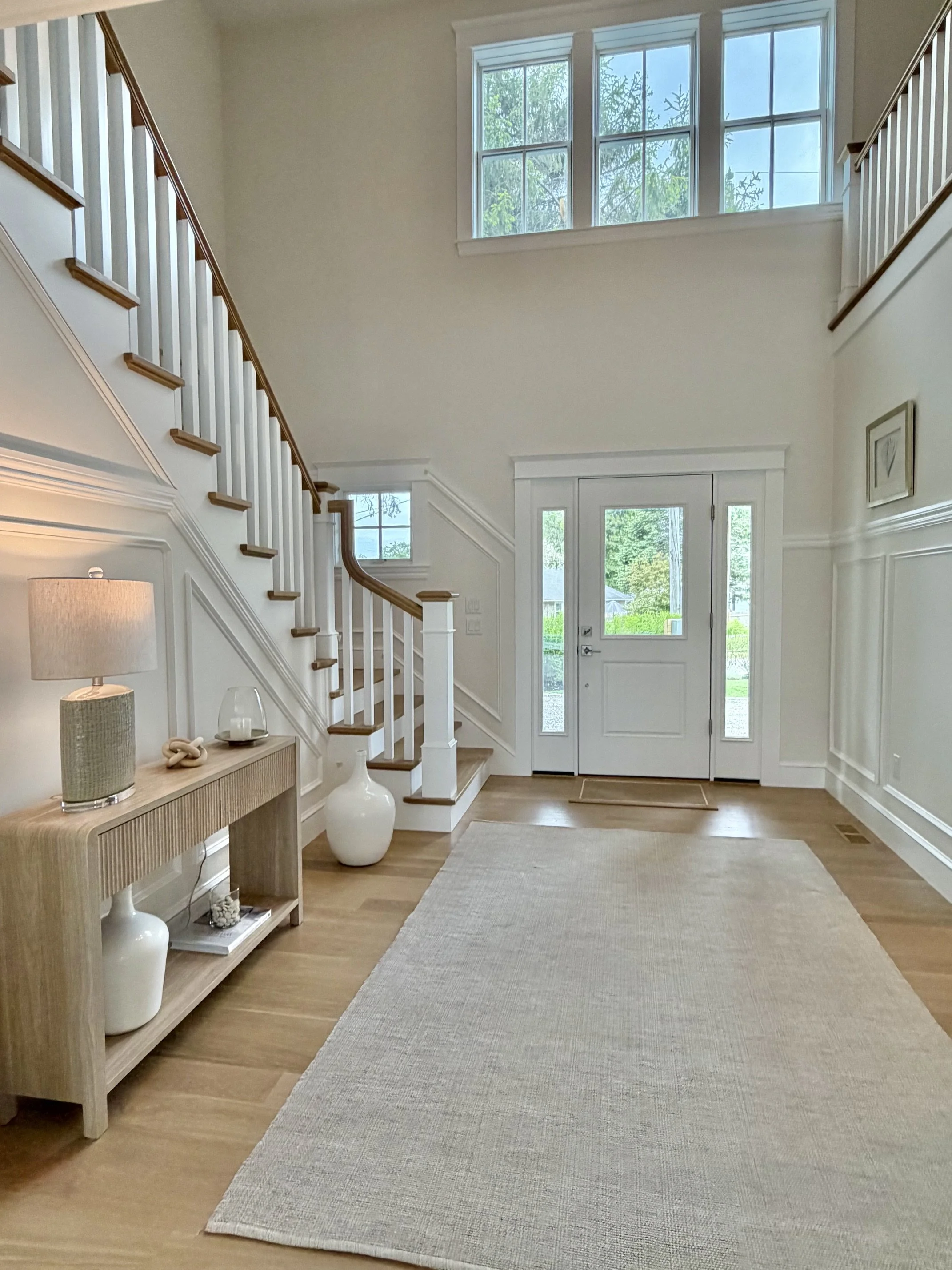 Front entryway showing front door and foyer of staged house