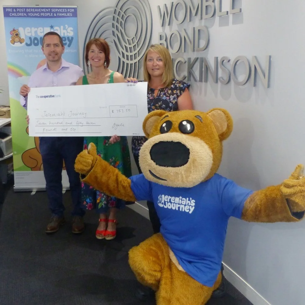 Jackie Gale artist presenting cheque in Plymouth to Jeremiahs Journey Childrens Charity