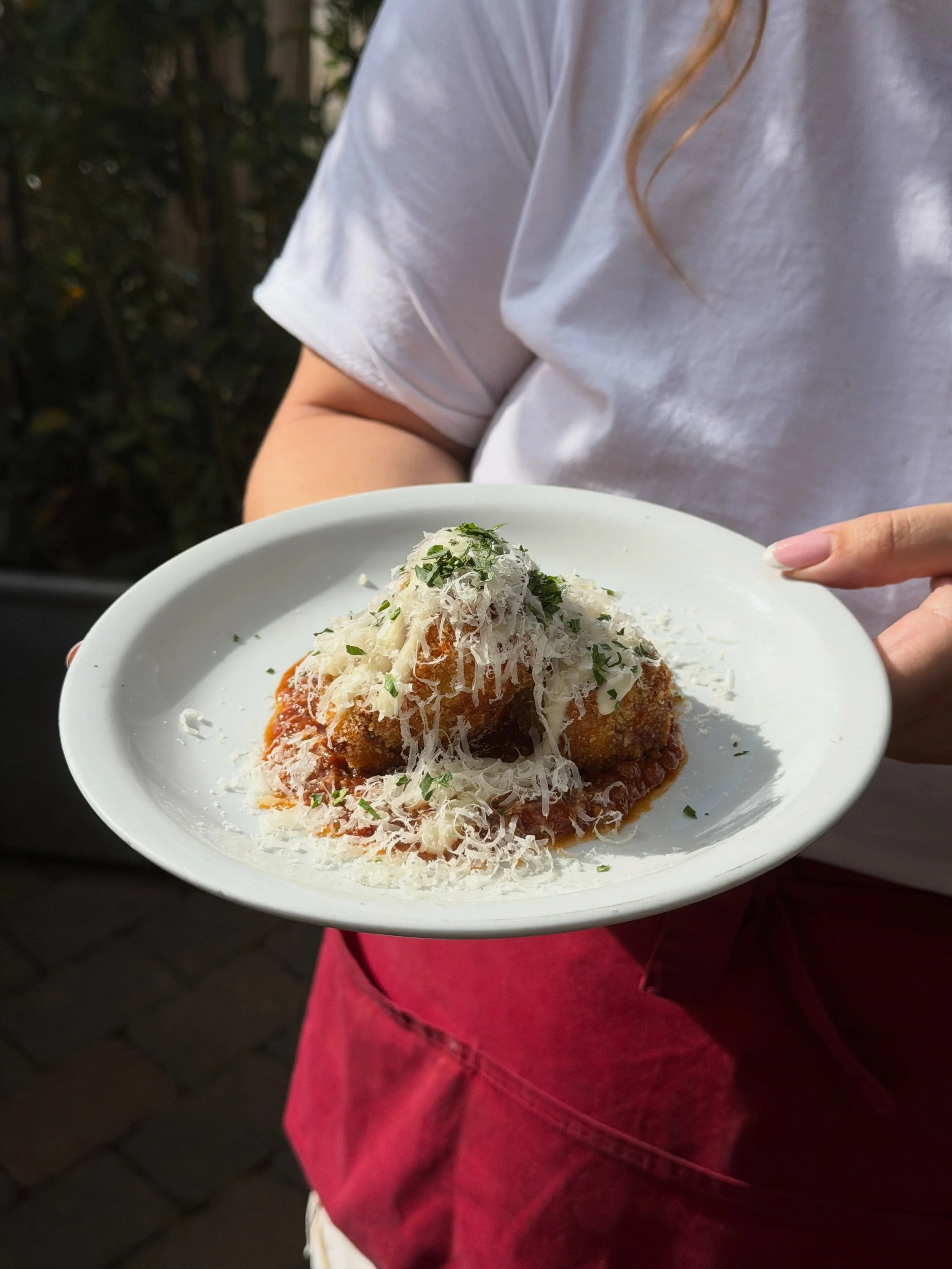 A new staff favourite, lasagne fritters topped with b&eacute;chamel &amp; Parmesan.