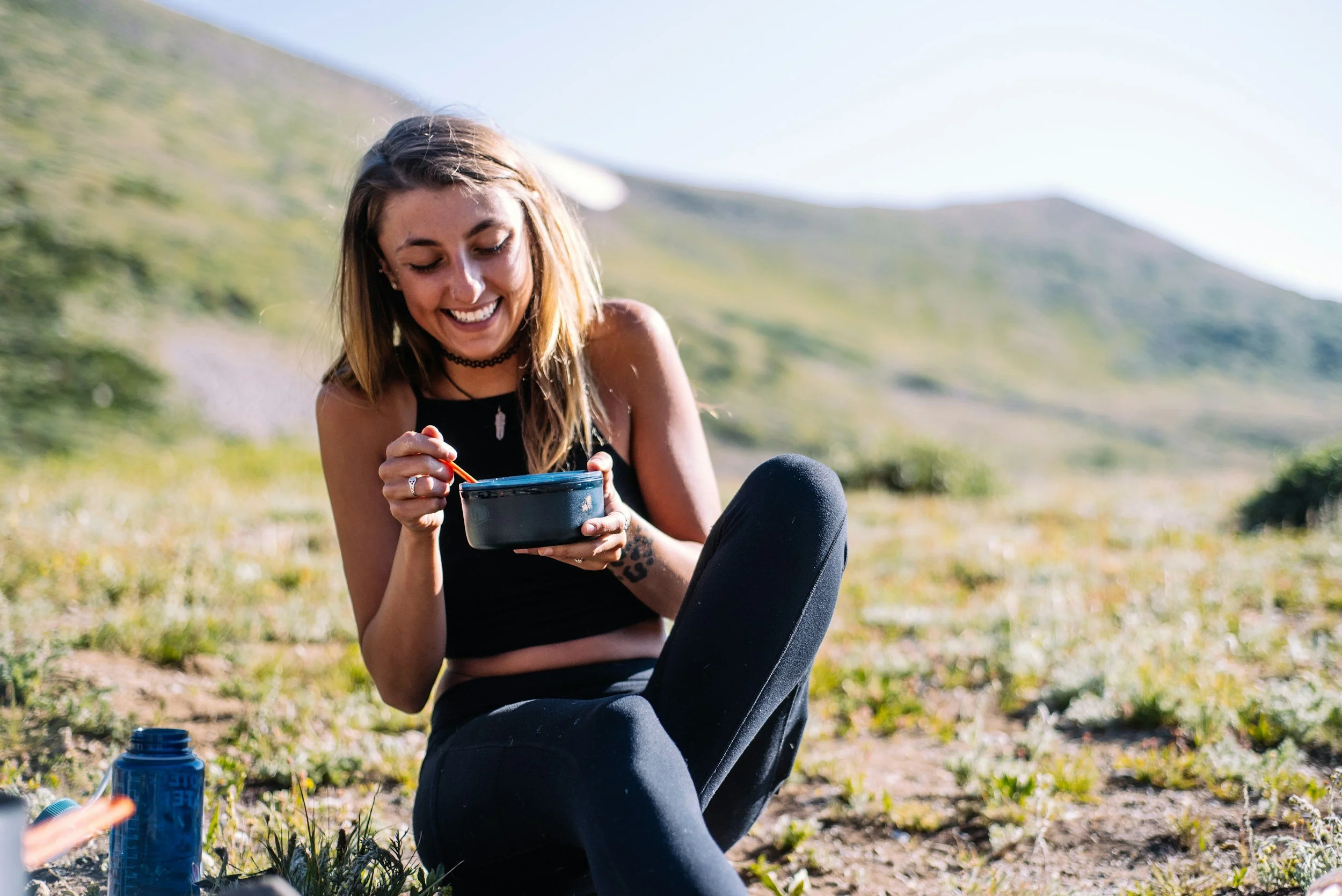 Woman happy eating outside after eating disorder therapy at SG therapy group
