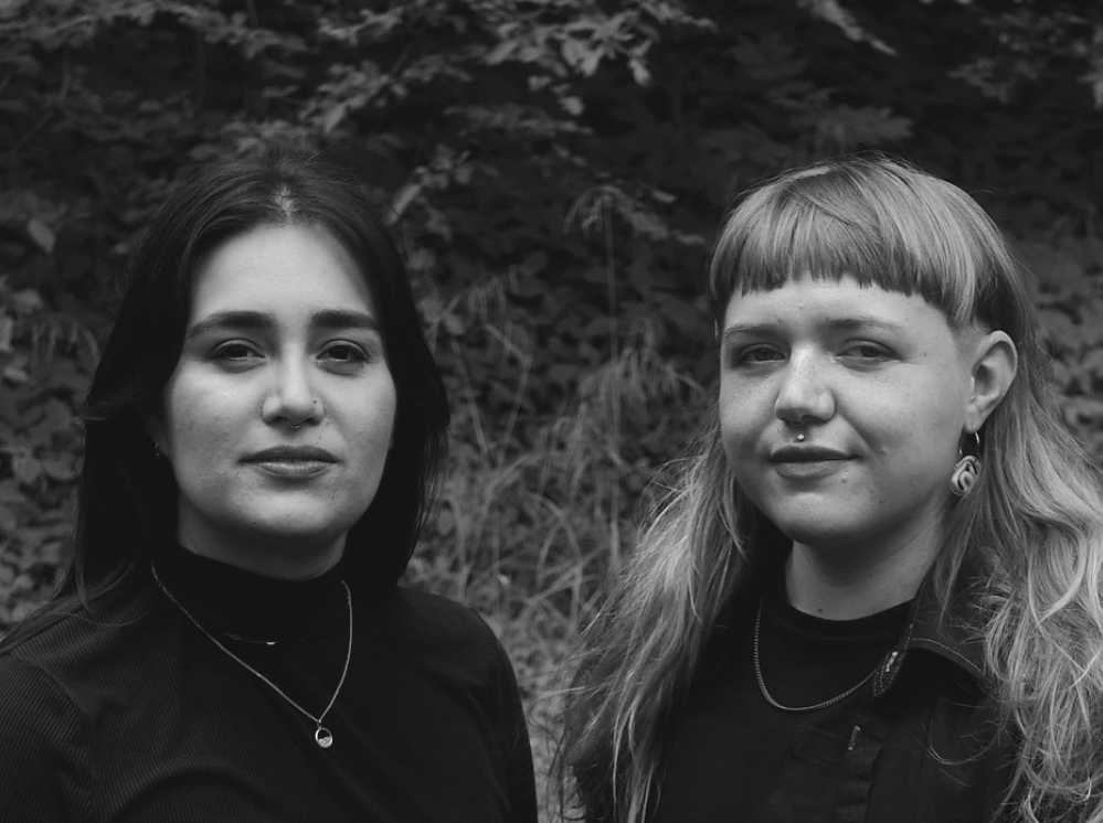 Black and white image of Guest Curators Pamela Vázquez Torres (left) and Emma Wood (right).