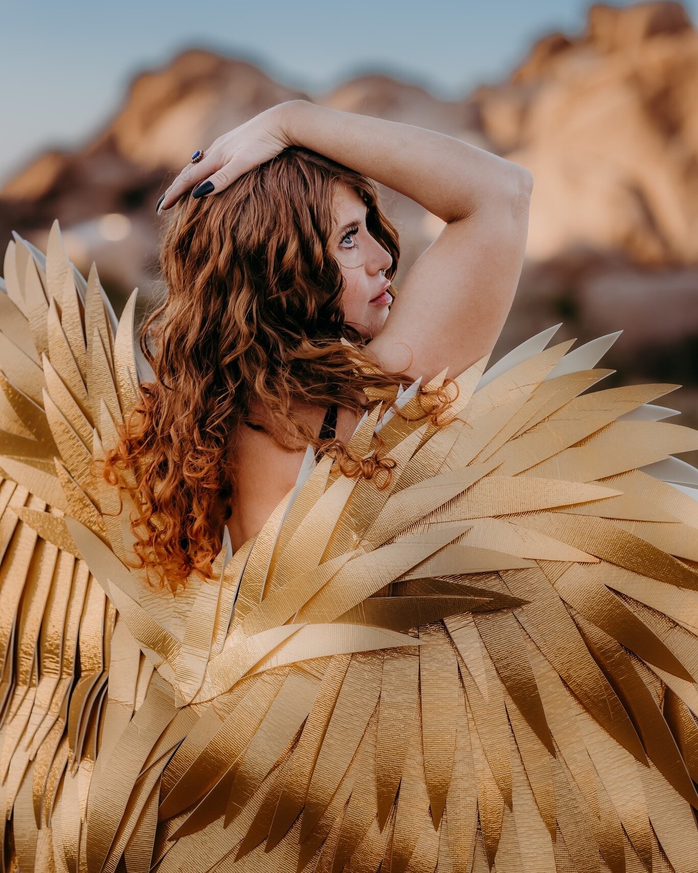 This beautiful, strong, redheaded woman matches the golden wings and is a symbol of freedom, beauty, and spiritual enlightenment, and her images inspire feelings of awe, wonder, and reverence when I look at her.

Let's leave her some love. And while 
