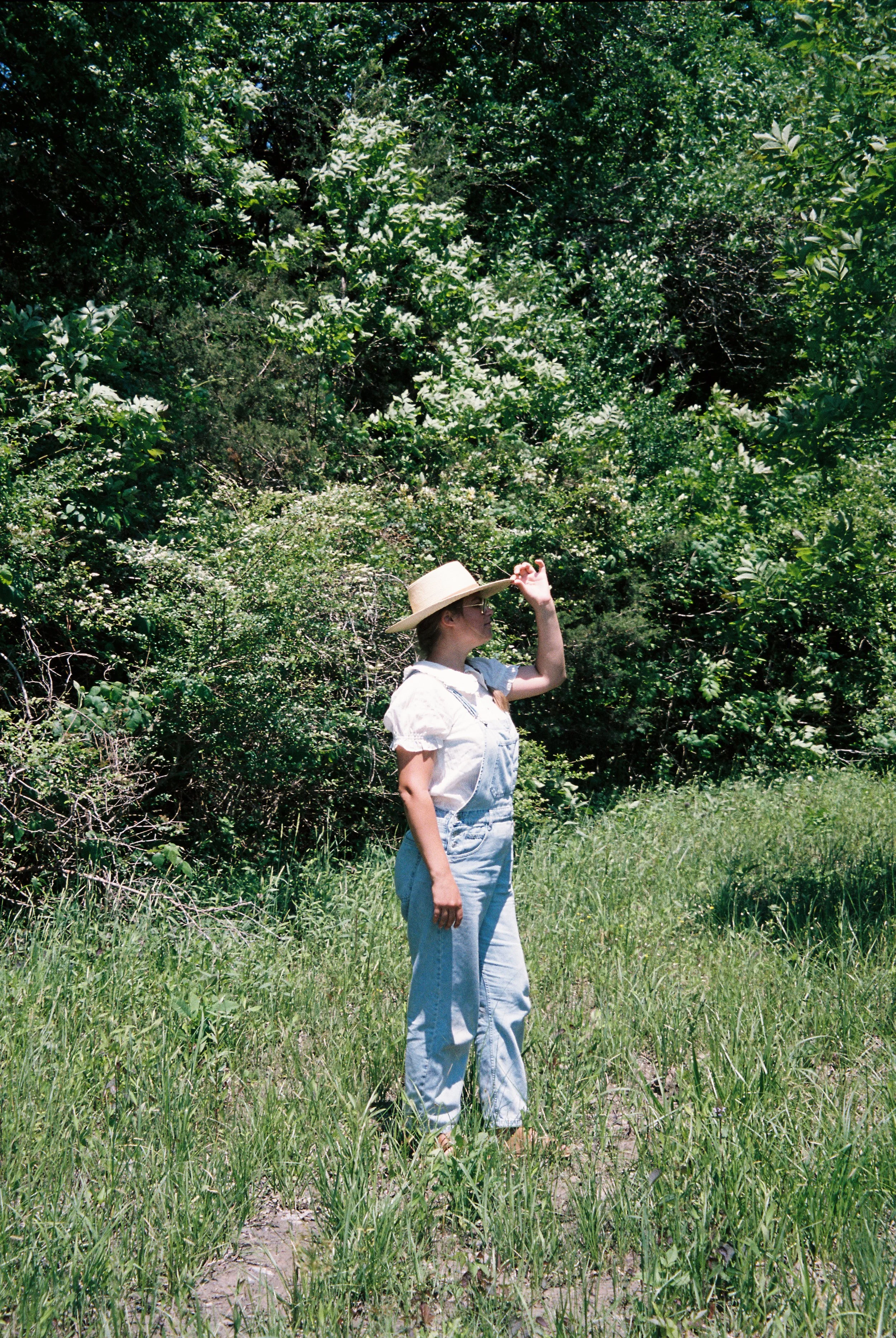 Birmingham wedding florist standing in a field in rural Alabama