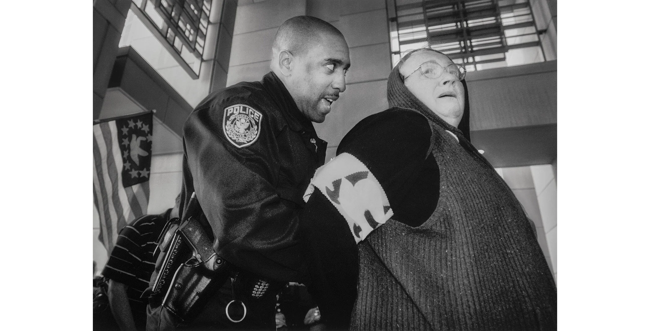 As the war drew nearer, the tactics of the movement attempting to stop it grew in intensity. In March, 2003, peace demonstrators attempted to block the entrance to the Federal Building in downtown Sacramento.  An elderly woman, participating in her f