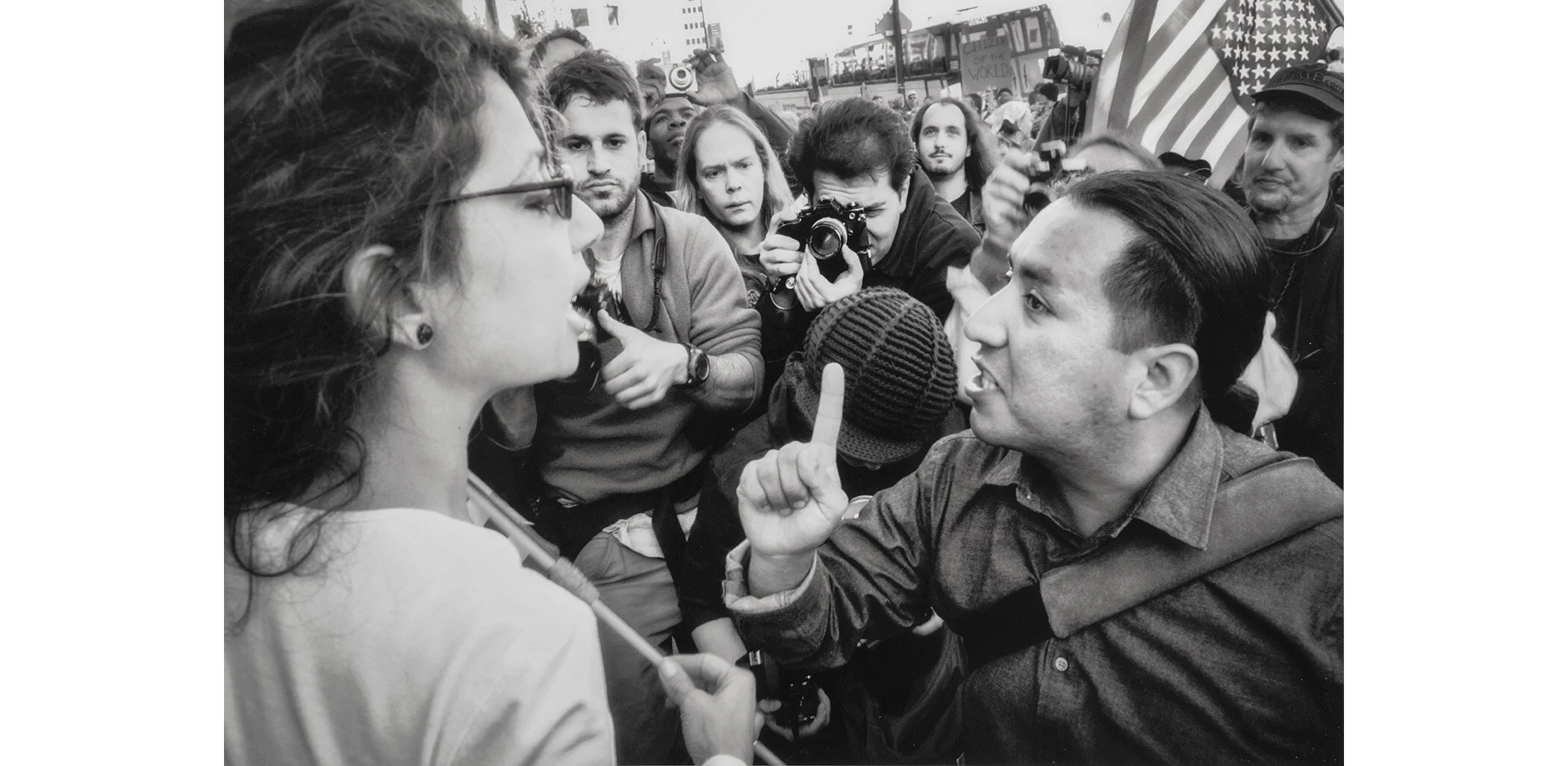 The war divided the country. Ideological fissures opened by the disputed presidential election a few years before now widened and deepened.  A Vietnam veteran against the war confronts a flag-waving Bush supporter at a San Francisco demonstration. As