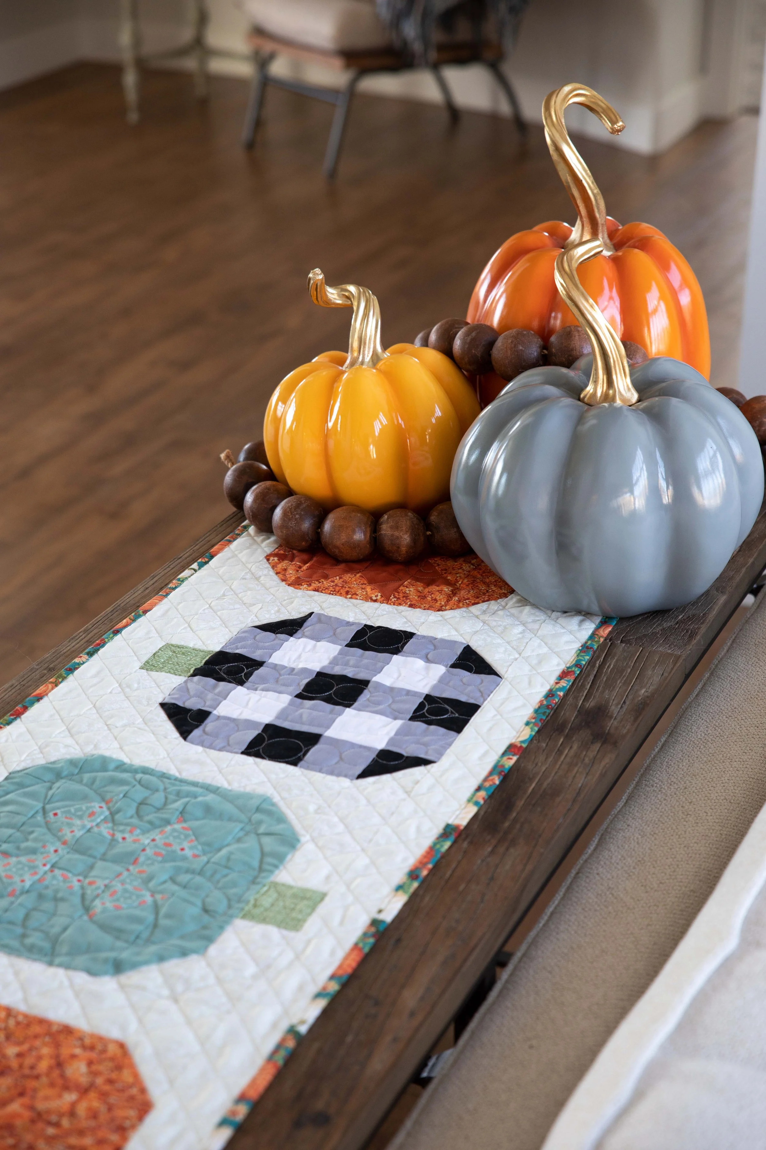 Fancy quilted pumpkin table runner that will keep your crafty hands