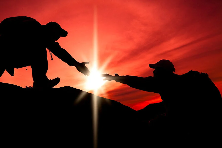 bigstock-Silhouette-of-helping-hand-bet-35213948.jpeg