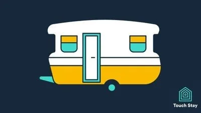 Retro camper trailer in white, yellow, and teal. Simple design with two windows and a door on dark background.
