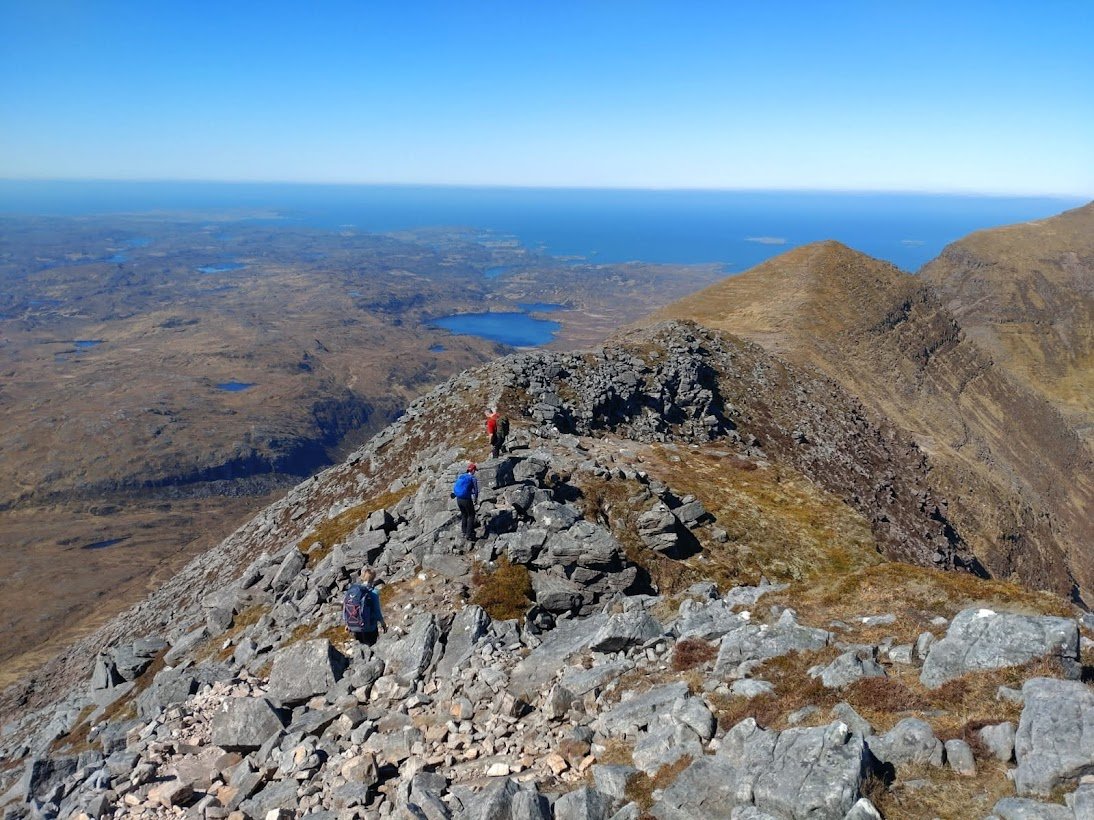 Mountain with walkers highlands