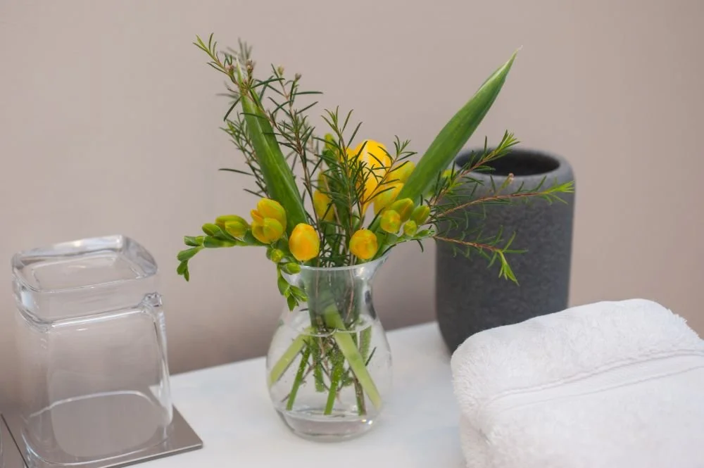 vase of yellow flowers