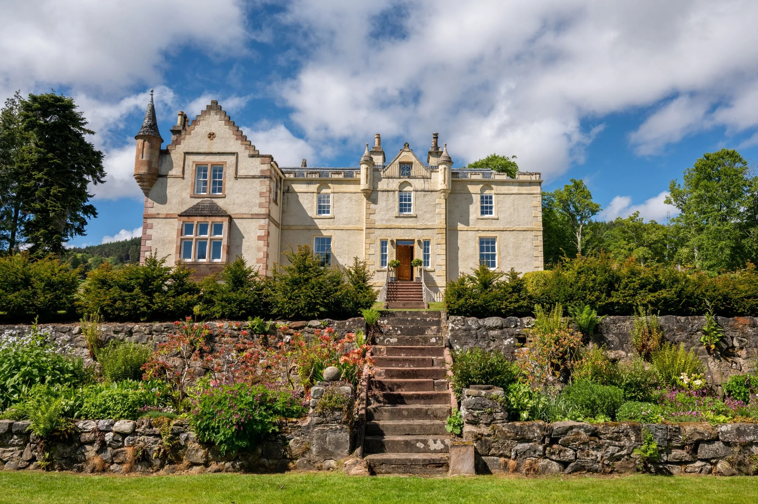 assynt house exterior view from the terraced lawn