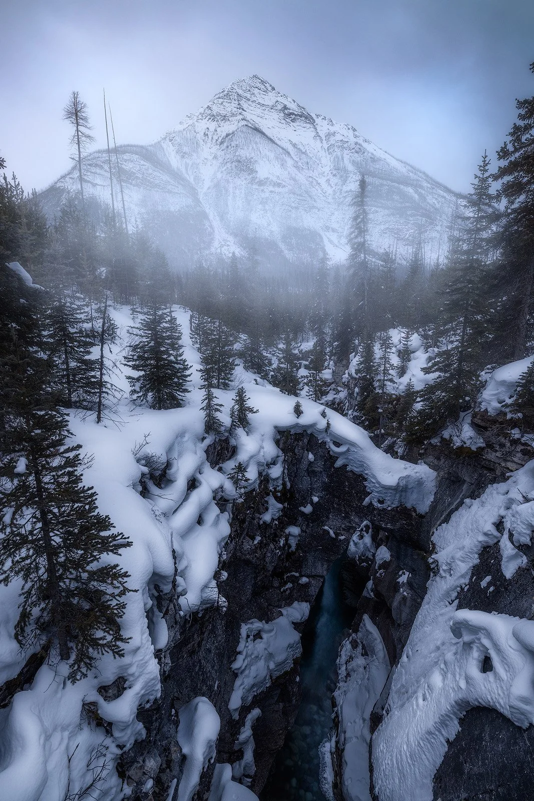 Marble Canyon Winter Gorge – Snow-Draped Cliffs Framing Turquoise Waters Beneath Towering Peaks.jpg
