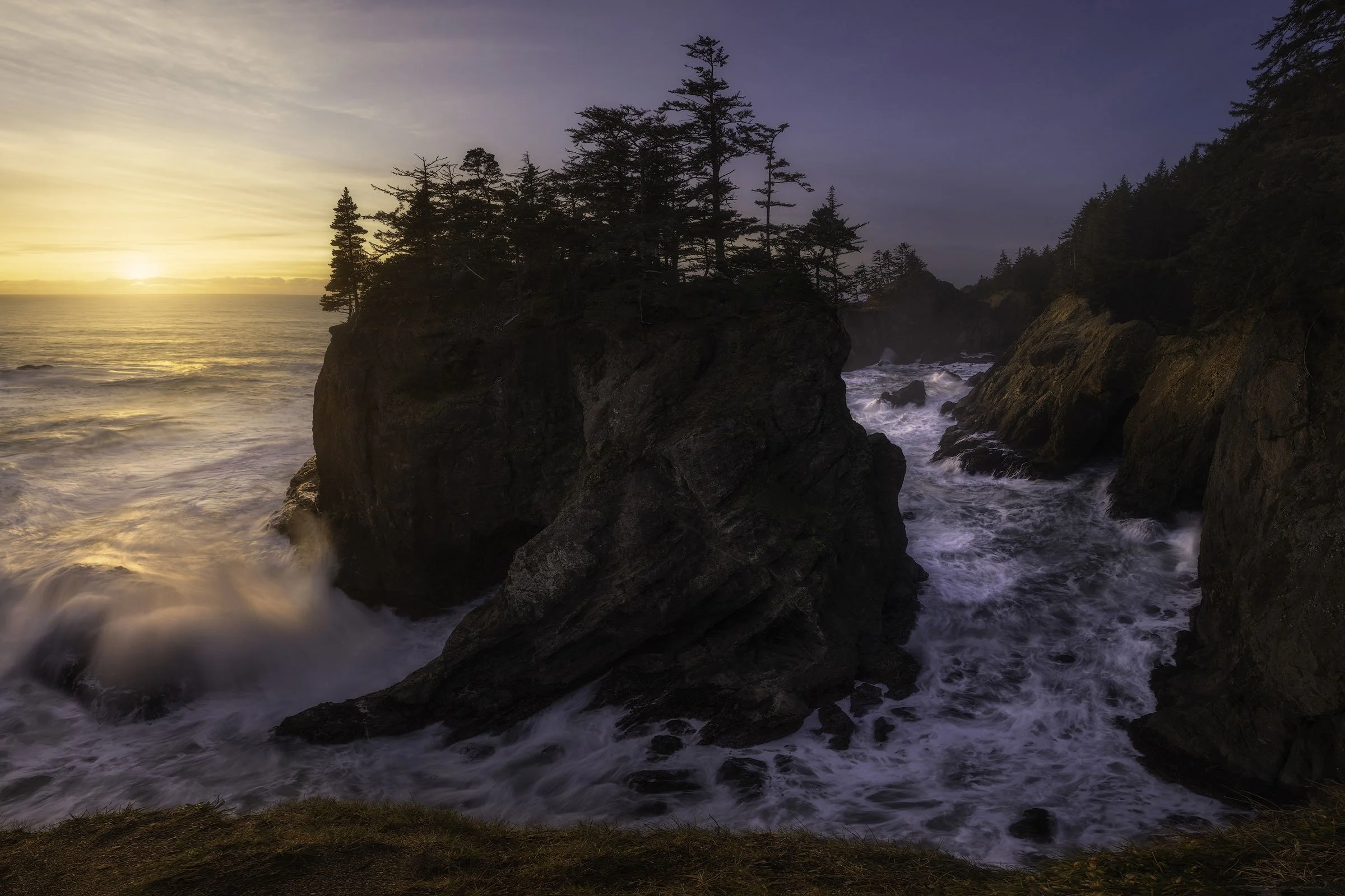 Oregon Coast Sunset – Waves Crash Against Sea Stacks Beneath Fiery Evening Sky.jpg