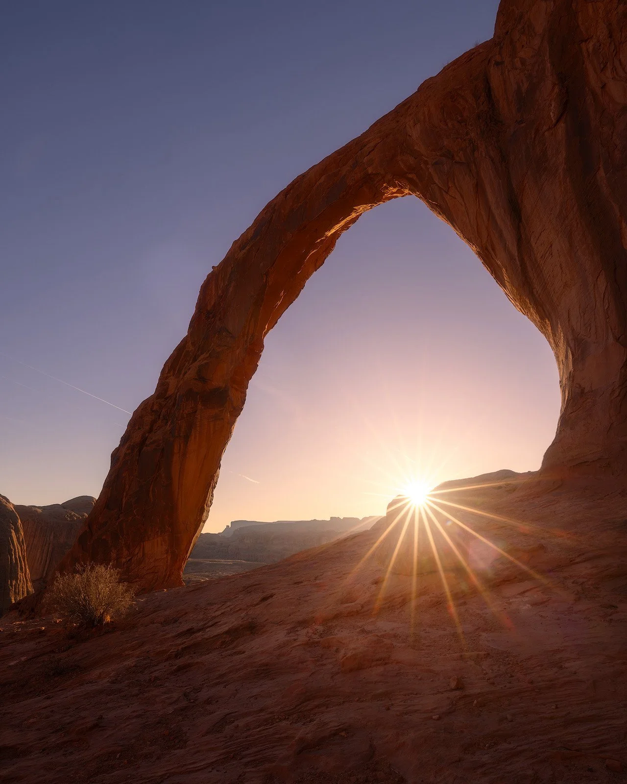 Corona Arch – Sunburst Framed Beneath Monumental Red Rock Arch at Sunset.jpg