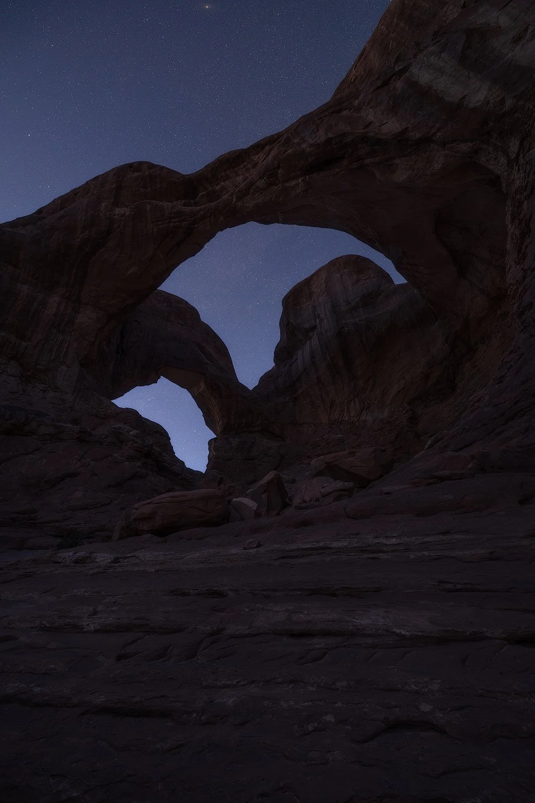 Double Arch – Twilight View Beneath Arches Framing a Star-Lit Desert Sky.jpg