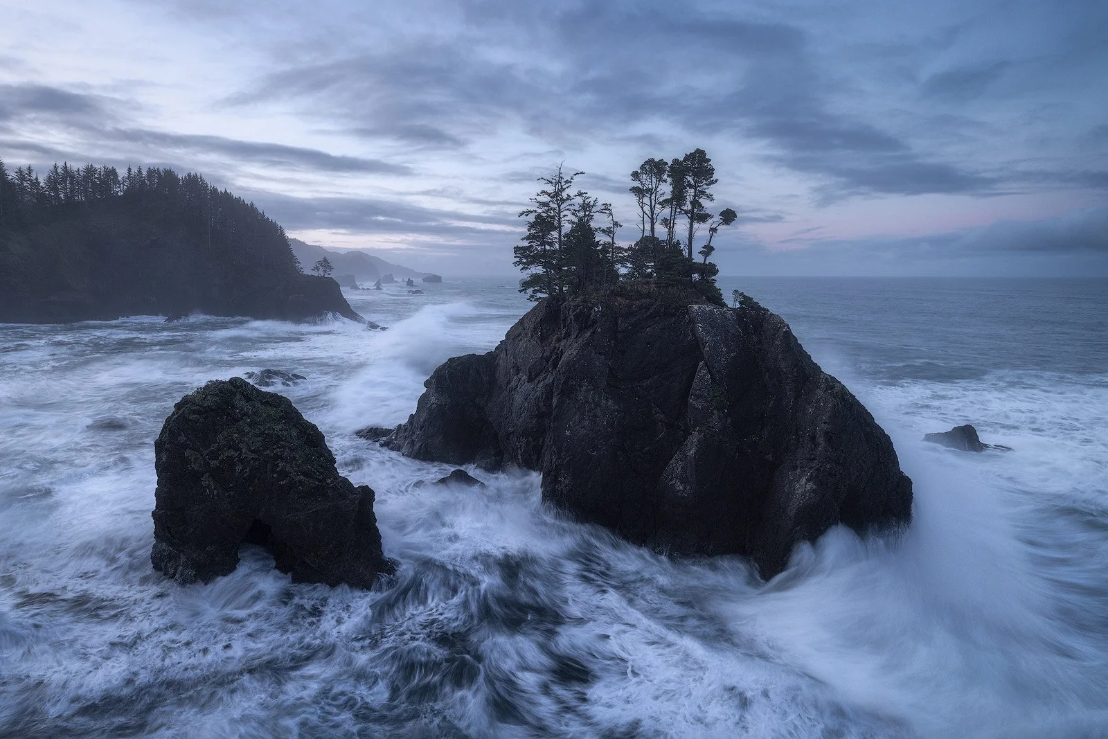 Oregon Coast Sunrise – Sea Stacks and Churning Waves Beneath a Stormy Morning Sky.jpg