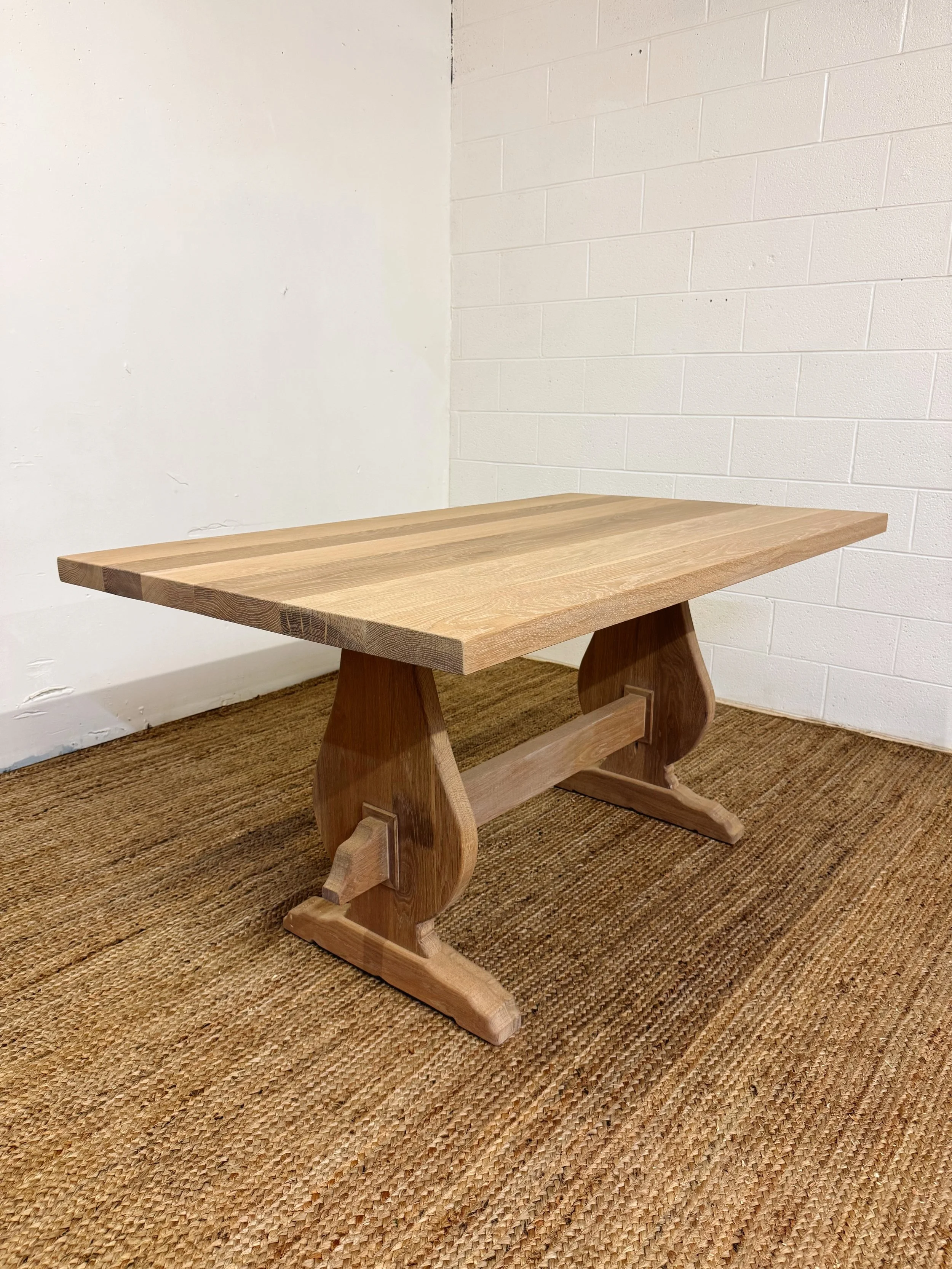White oak table with our french country legs. Stained in @rubiomonocoatusa Natural. Also shoutout to the new rug for hiding the scary looking shop floor!