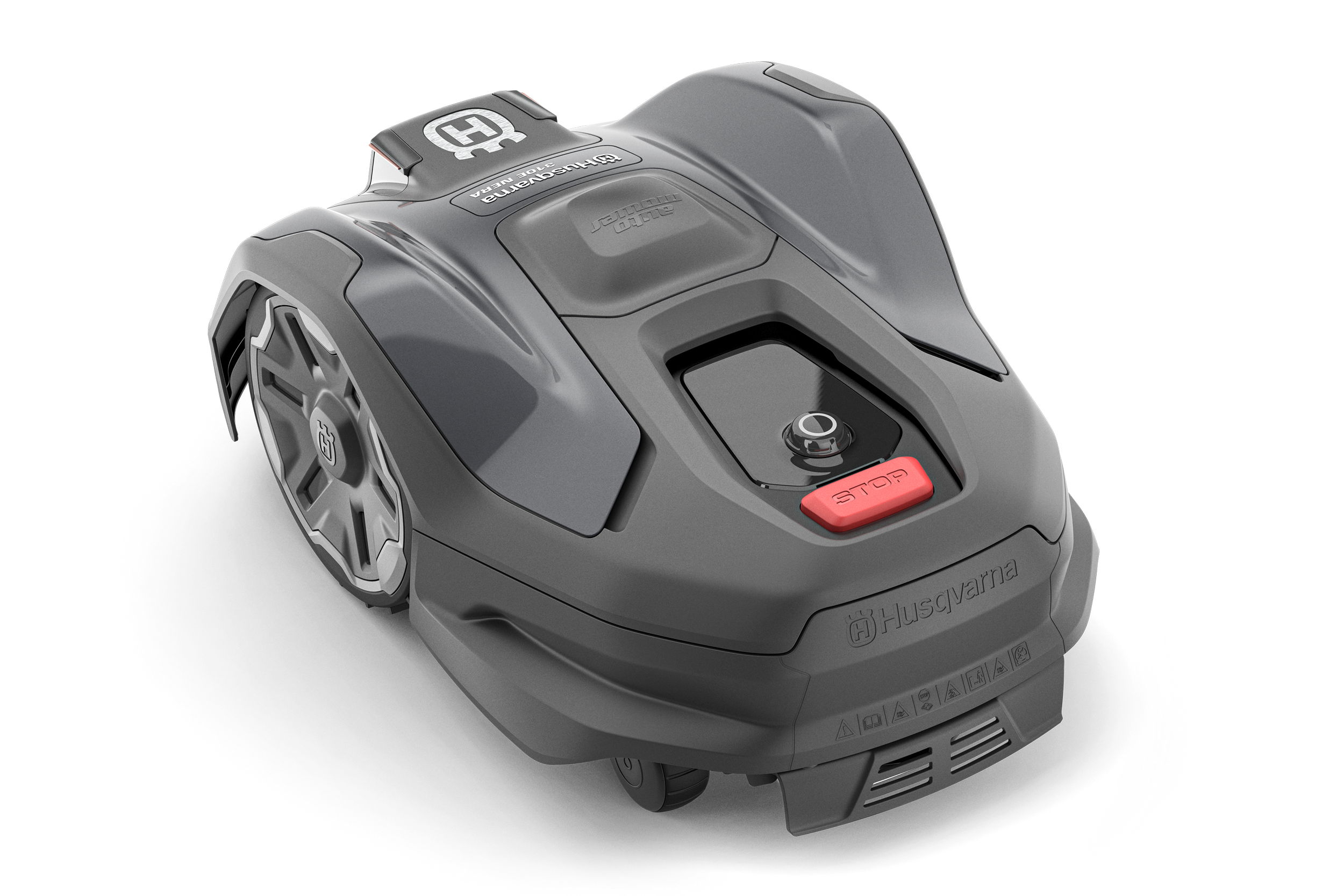A robotic lawn mower with a gray body, featuring a red stop button, a control dial, and Husqvarna branding. It has large wheels and is designed for autonomous yard maintenance.