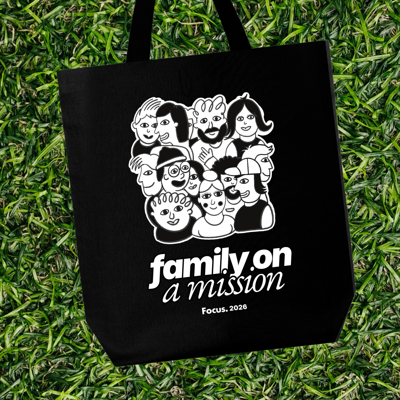 Family on a Mission Black tote on grass.png