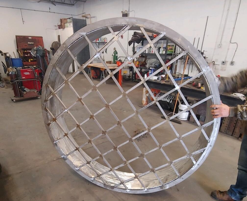 Large metal grid circle in workshop