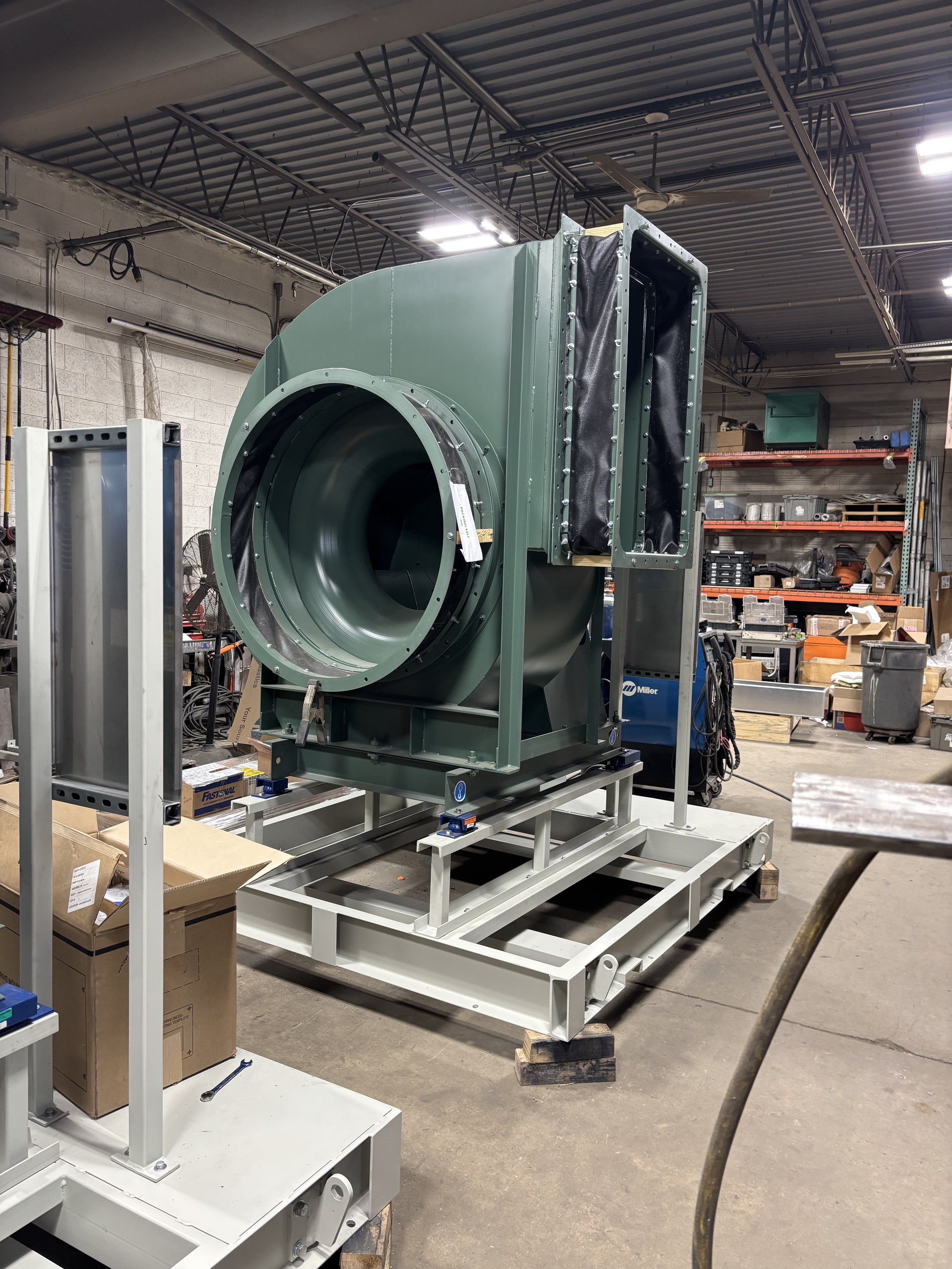 Large industrial blower fan in a workshop setting