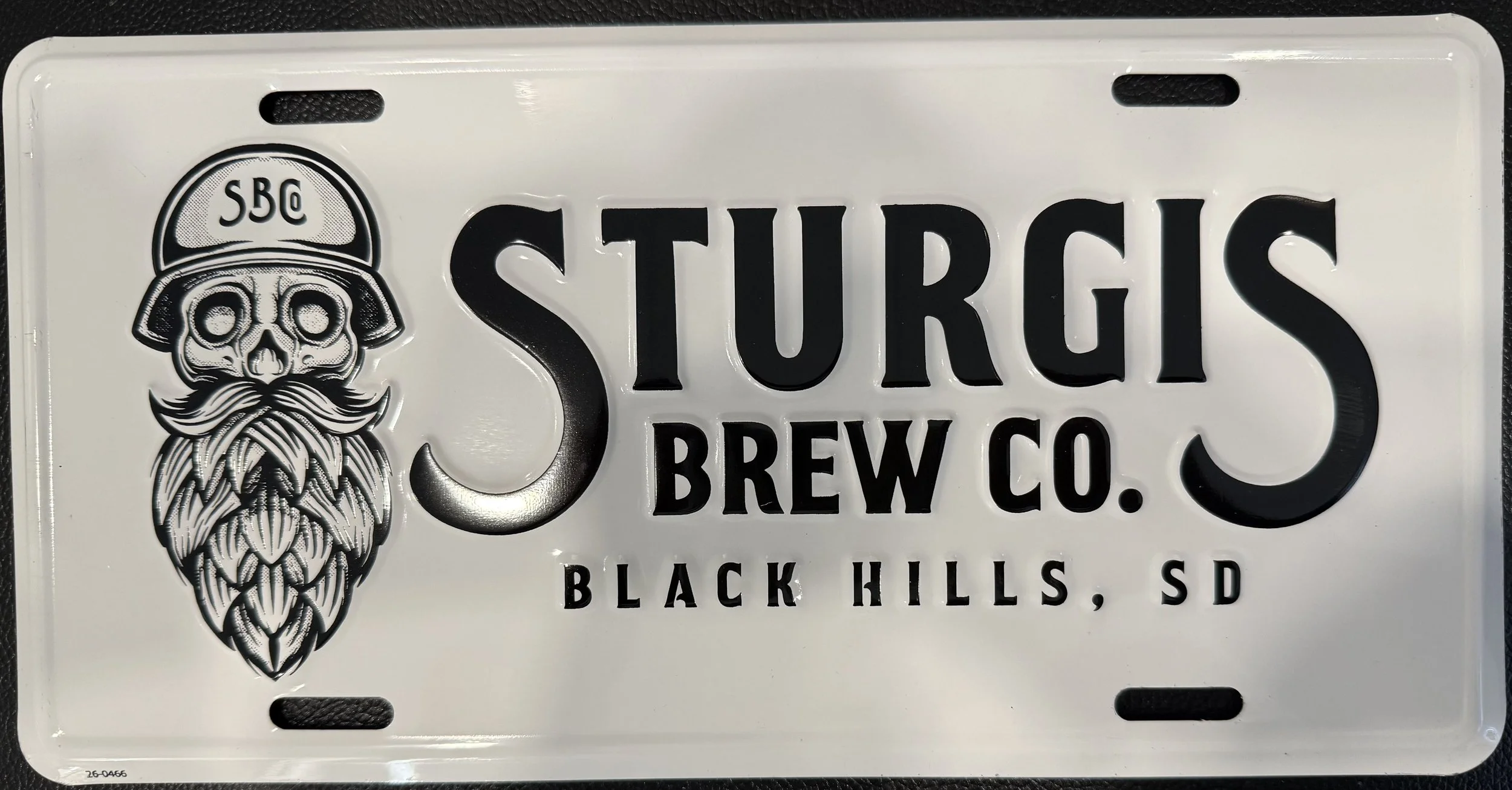 Black and White Skully Stacked Logo License Plate.jpeg