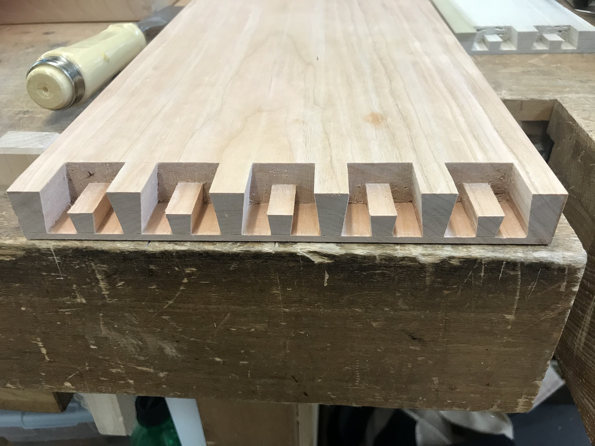 The female joint cleaned up from "Little Hog" bench in cherry. Test cut in poplar can be seen in the background.