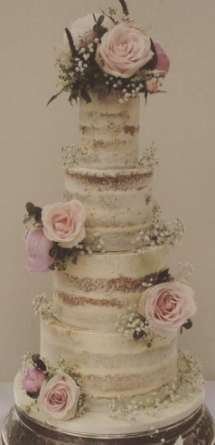 Covered naked cake with pale pink roses.PNG