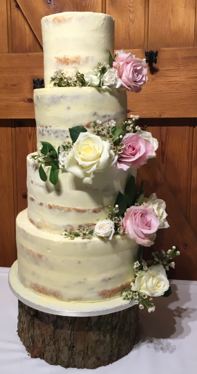 Fully naked cake with pink and white roses.PNG