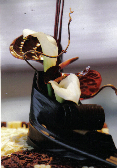 Bi coloured chocolate cigarello cake arum lilies close up.PNG