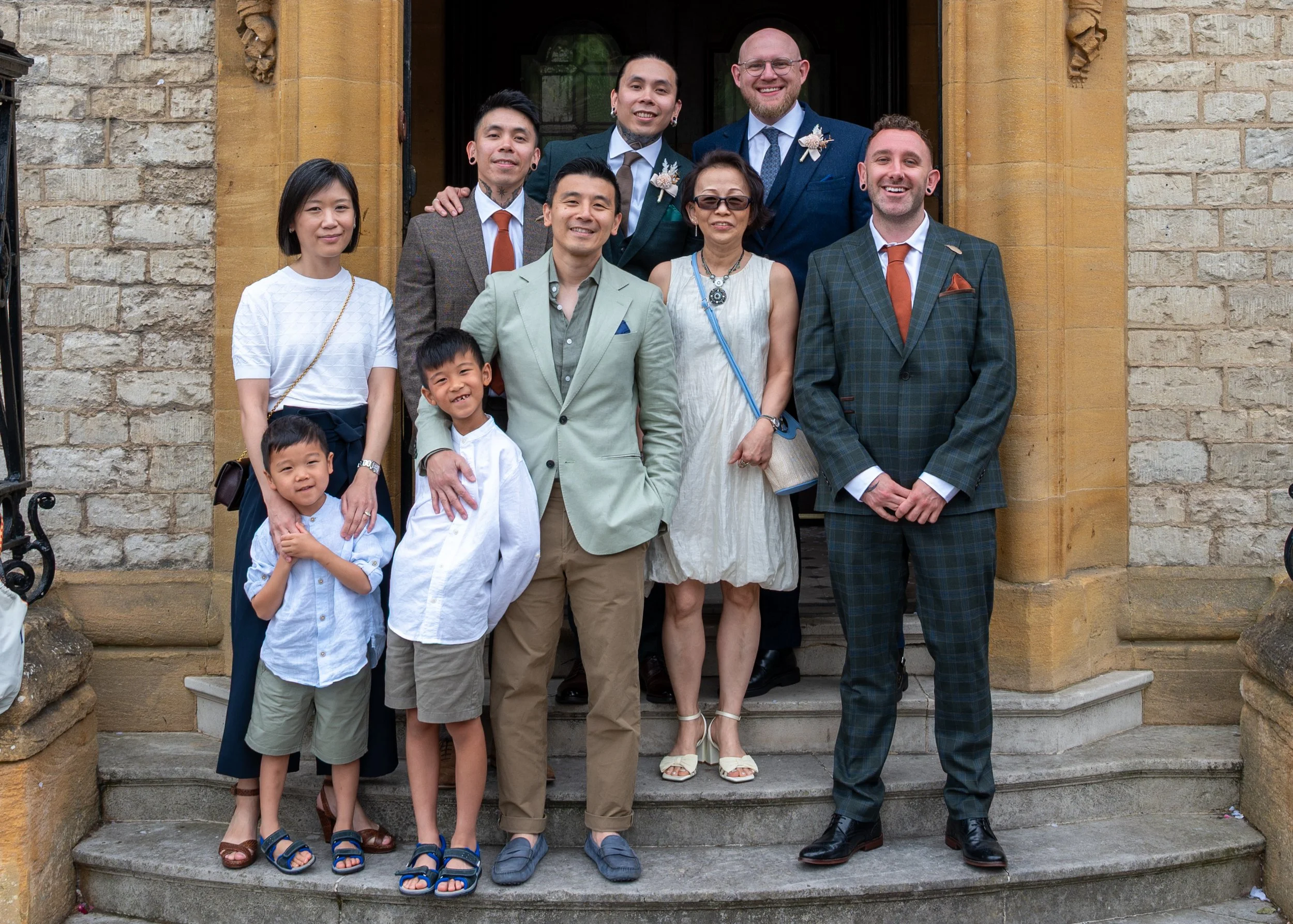 Wedding Guests pose for a photo outside The Oxford Registry Office 